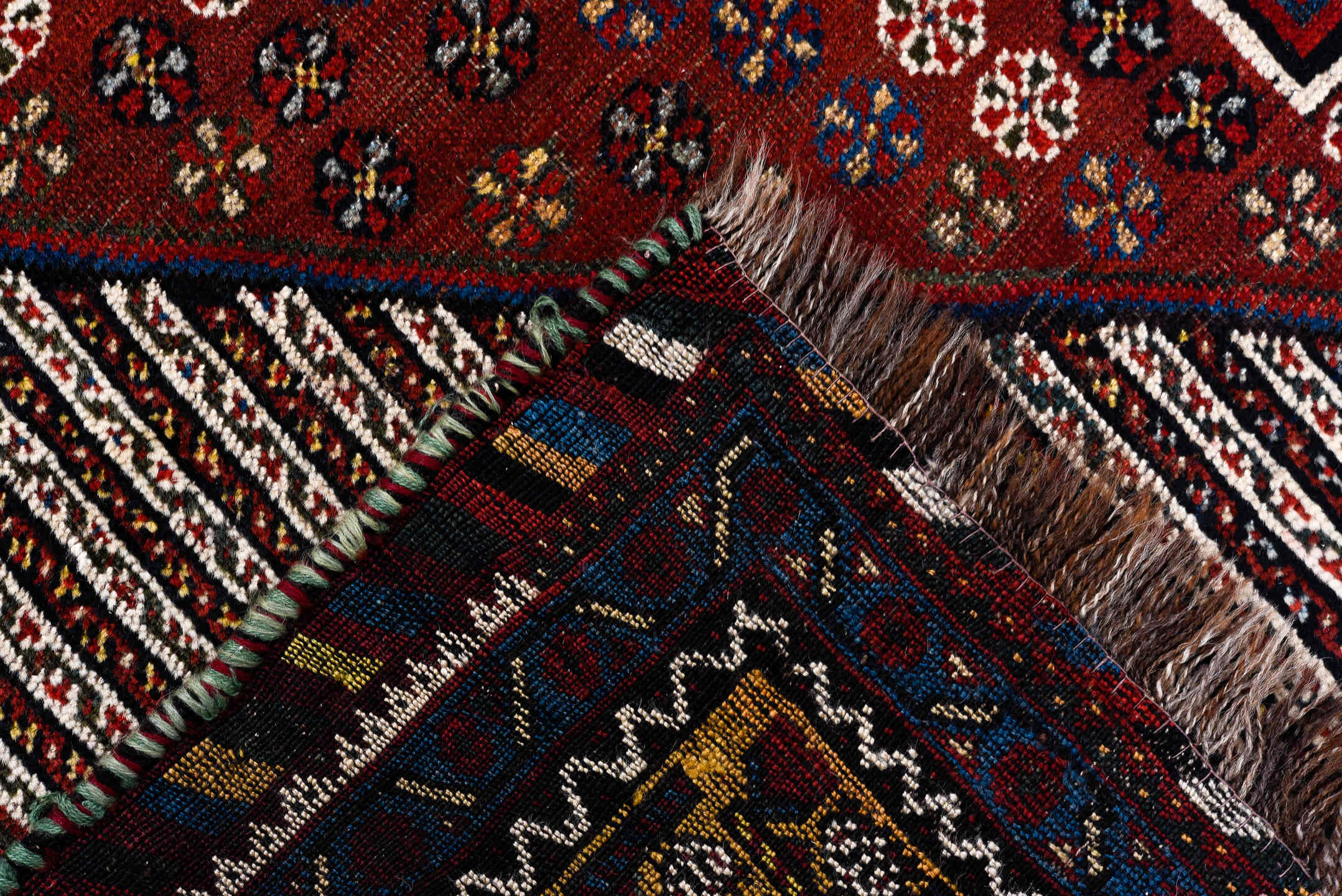 5' x 8' one-of-a-kind handmade antique Qashqai medium size rug. Color palette: rust, indigo, ivory, gold, navy, brown