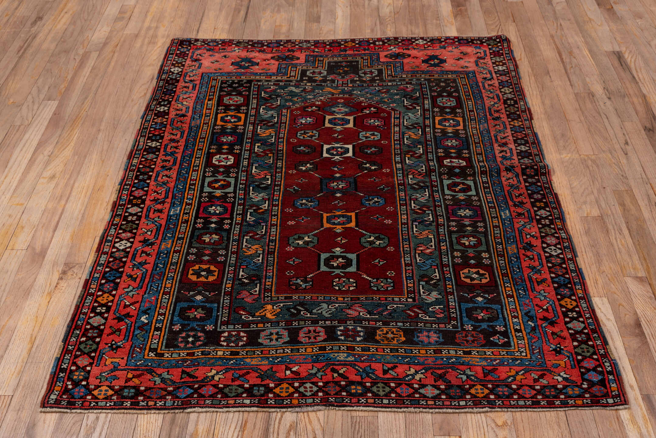 4' x 5' one-of-a-kind handmade antique Shirvan small size rug. Color palette: coral, burgundy, indigo, navy, ivory, slate