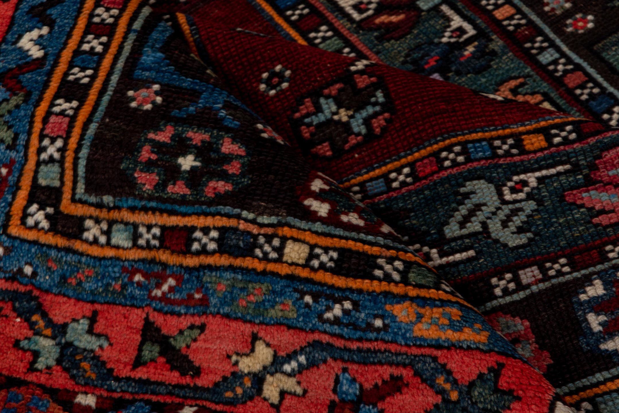 4' x 5' one-of-a-kind handmade antique Shirvan small size rug. Color palette: coral, burgundy, indigo, navy, ivory, slate