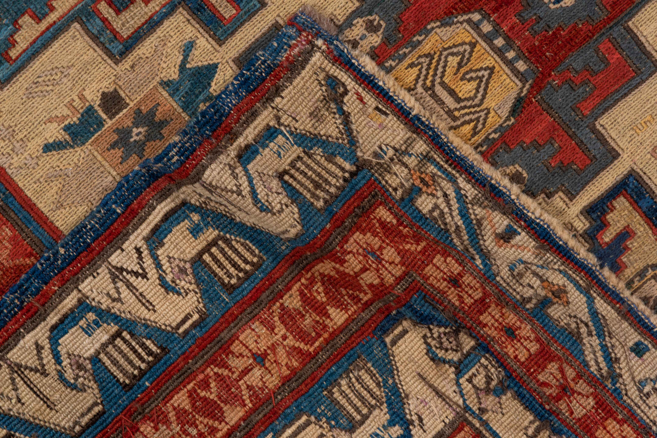 3' x 8' one-of-a-kind handmade antique Sumak runner rug. Color palette: ivory, rust, indigo, blue, gold, sage, camel