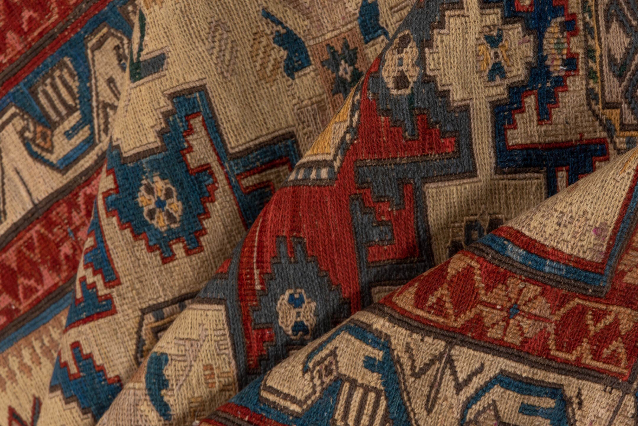 3' x 8' one-of-a-kind handmade antique Sumak runner rug. Color palette: ivory, rust, indigo, blue, gold, sage, camel