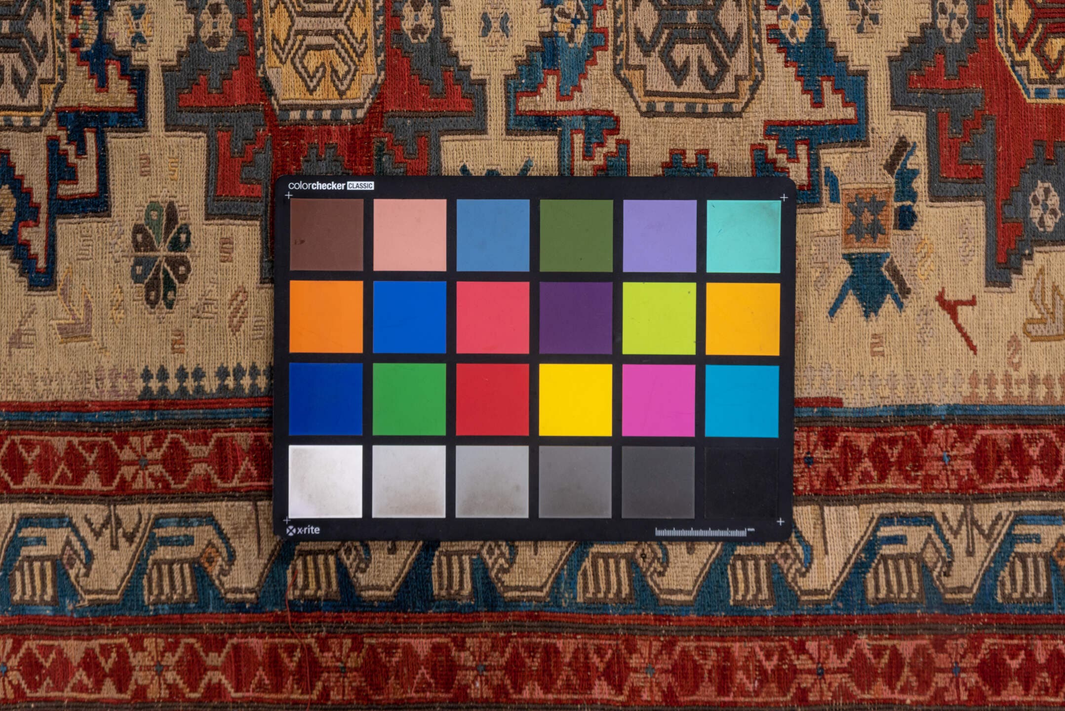 3' x 8' one-of-a-kind handmade antique Sumak runner rug. Color palette: ivory, rust, indigo, blue, gold, sage, camel