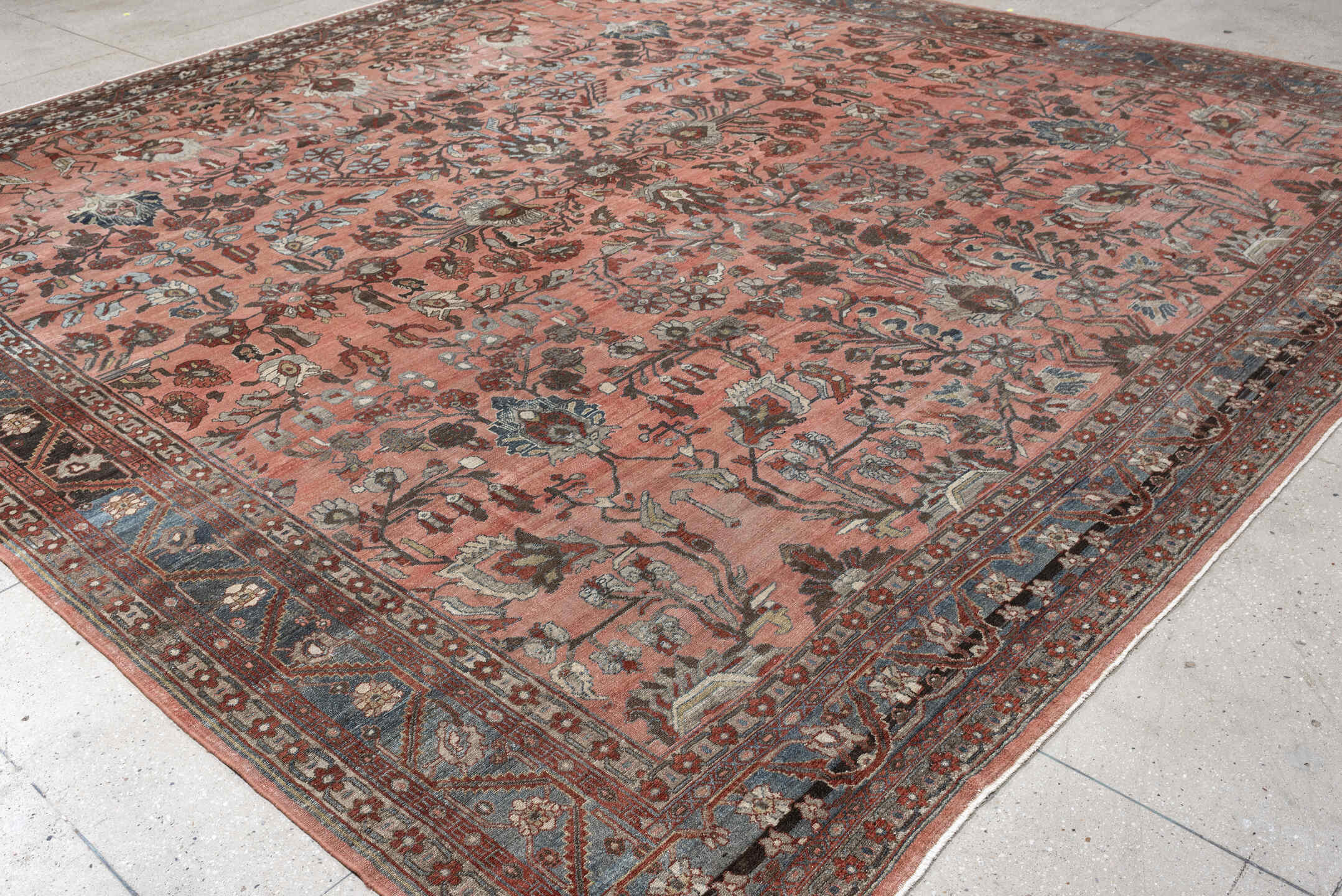 12' x 13' one-of-a-kind handmade antique Lilian oversize rug. Color palette: rose, indigo, ivory, brown, slate, terra cotta