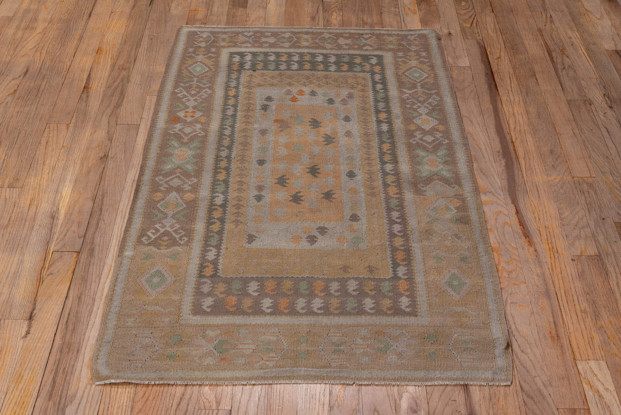 3' x 5' one-of-a-kind handmade antique Belouch small size rug. Color palette: taupe, camel, ivory, sage, terra cotta