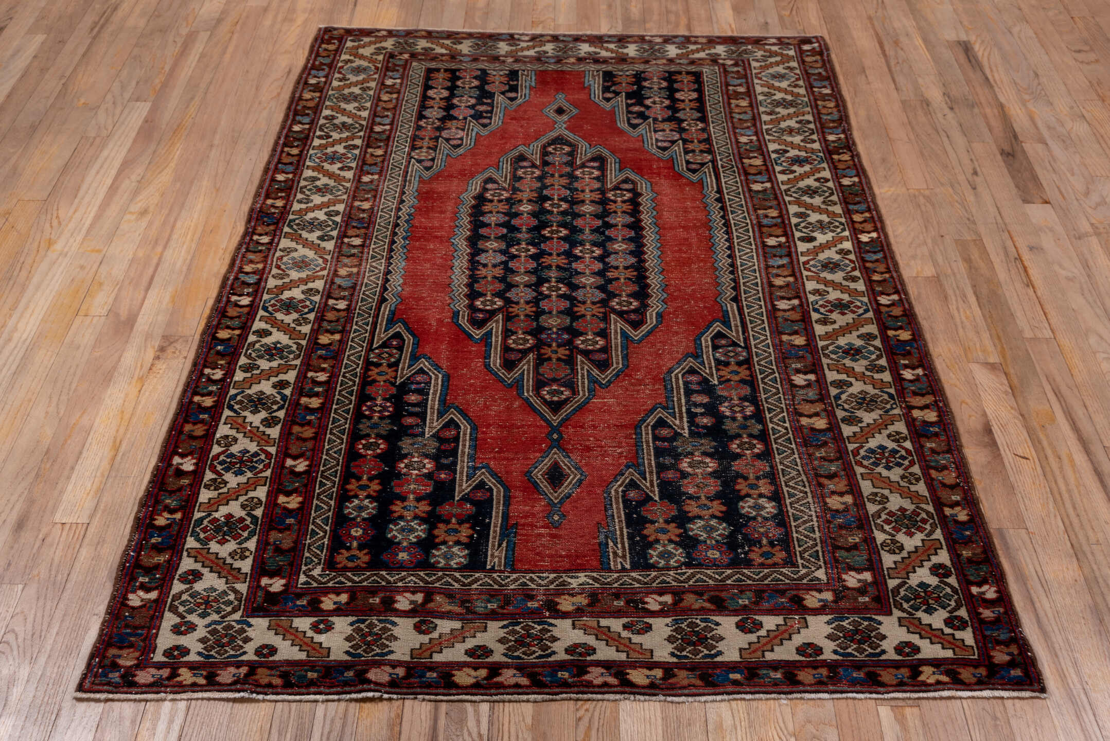 4' x 6' one-of-a-kind handmade antique Malayer small size rug. Color palette: rust, ivory, navy, burgundy, sky_blue, camel