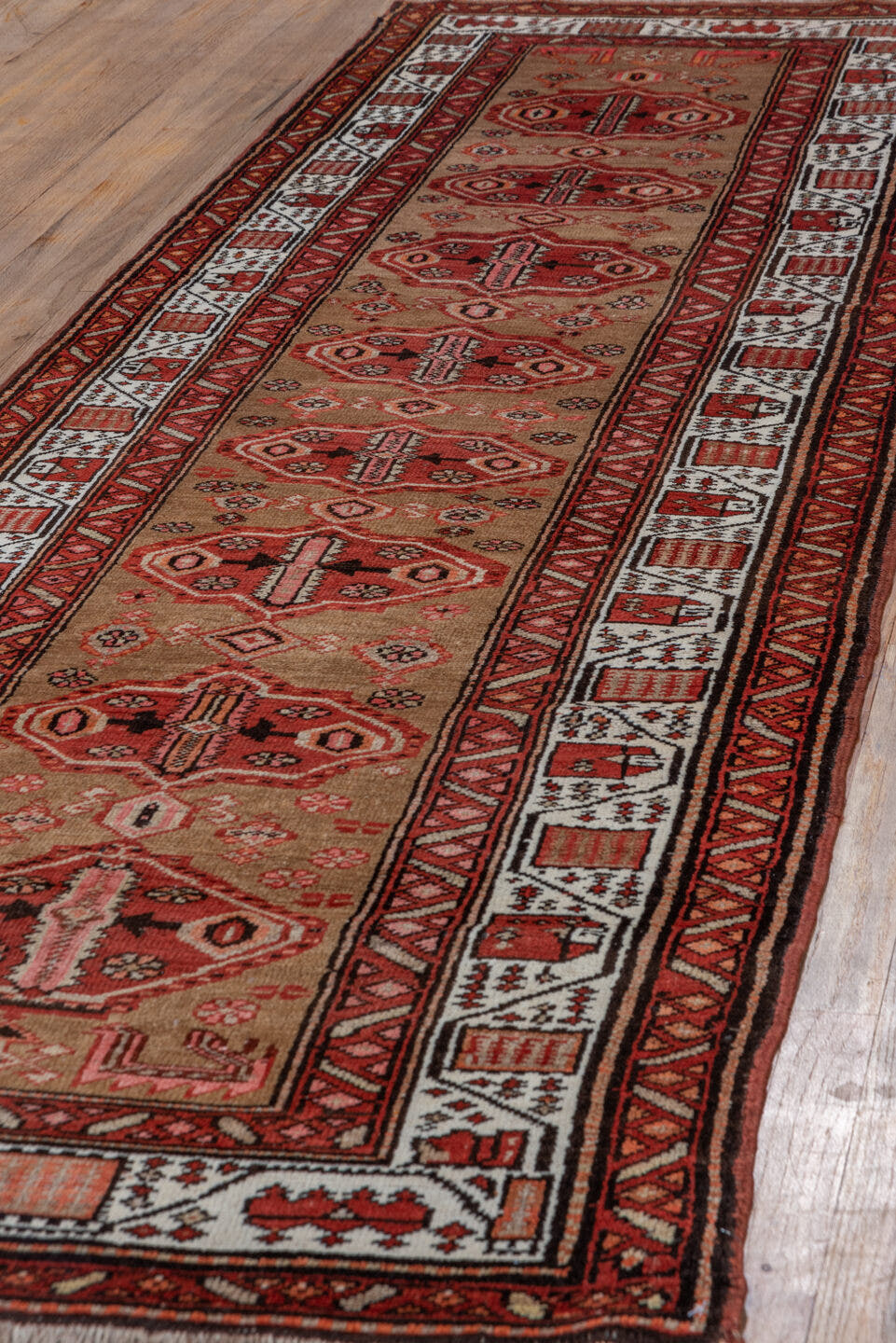 3' x 10' one-of-a-kind handmade antique Sarab runner rug. Color palette: rust, camel, ivory, brick, brown, charcoal