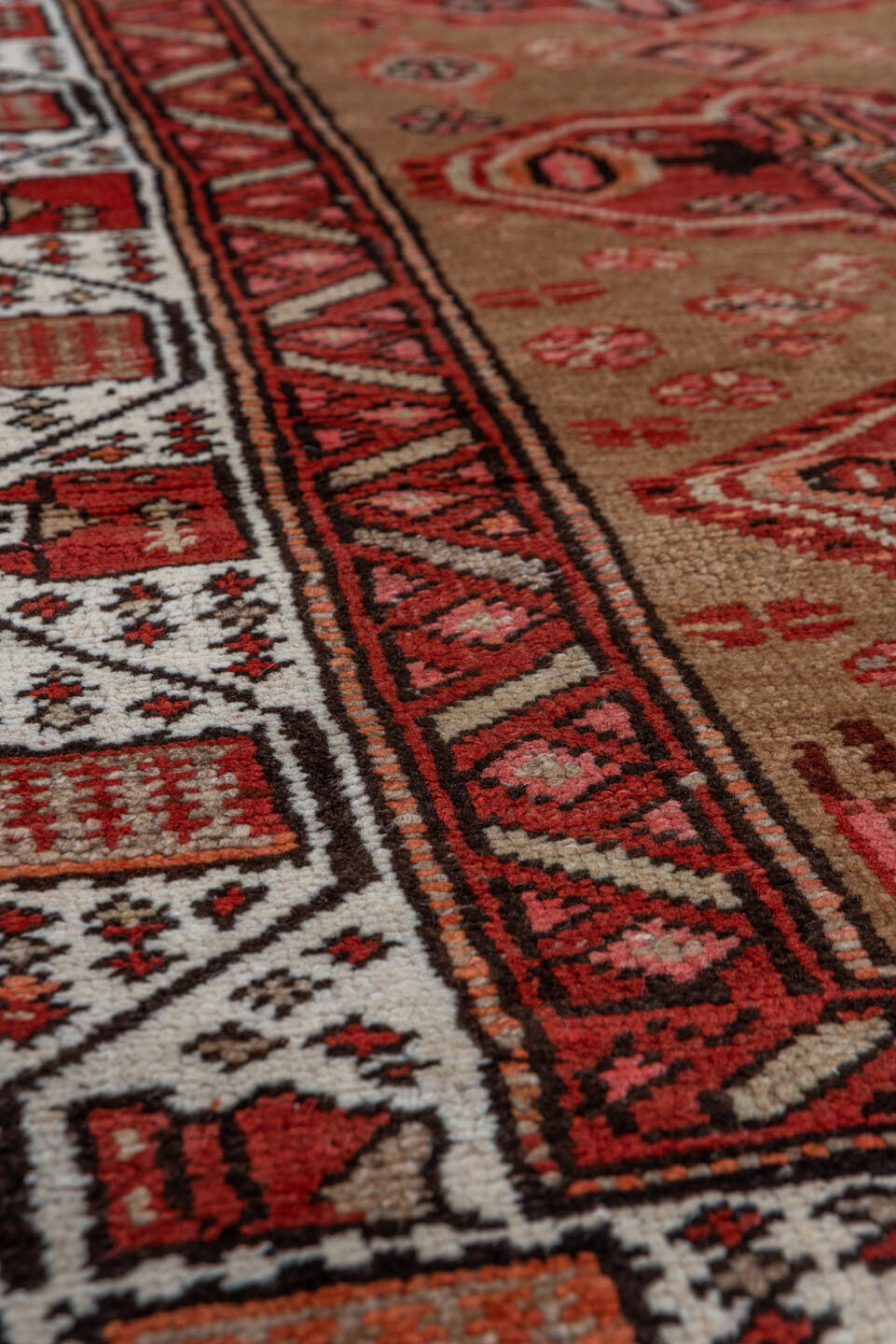 3' x 10' one-of-a-kind handmade antique Sarab runner rug. Color palette: rust, camel, ivory, brick, brown, charcoal