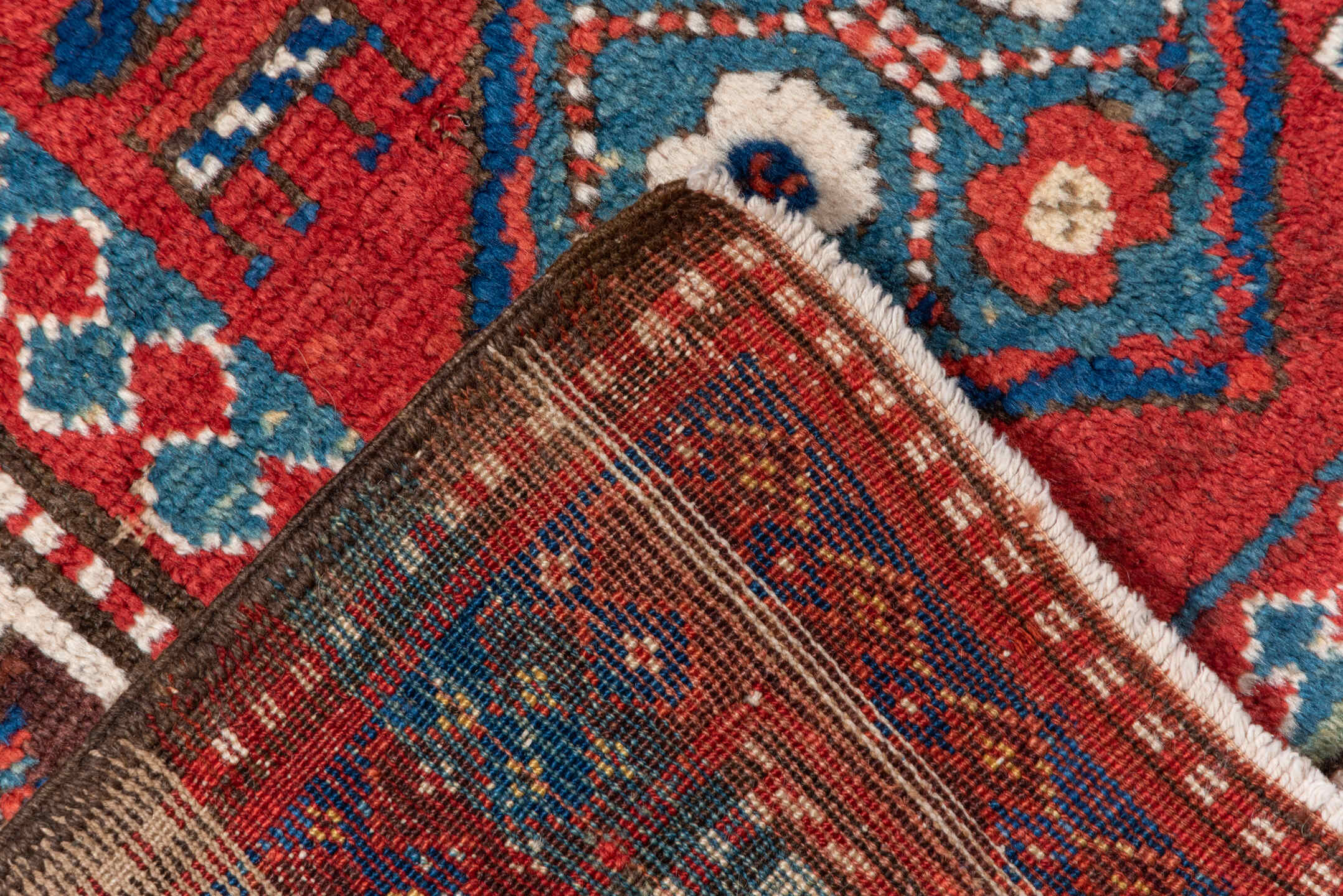 3' x 8' one-of-a-kind handmade vintage Kazak runner rug. Color palette: arapawa, blue, brown, fiord, gray, pink, red