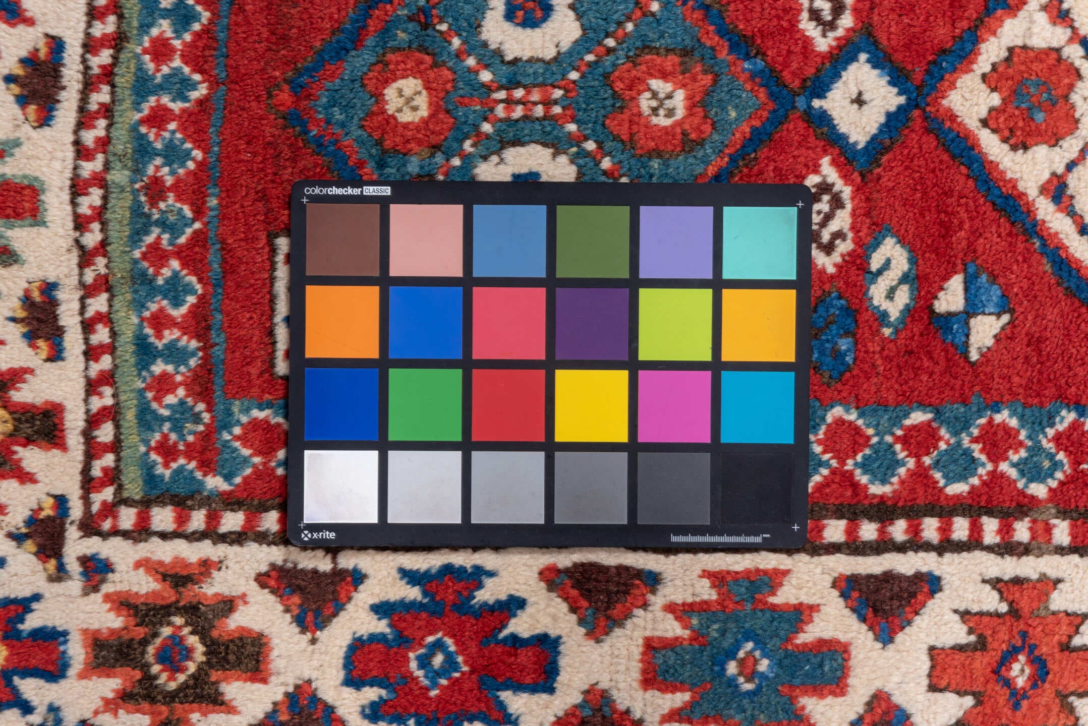 3' x 8' one-of-a-kind handmade vintage Kazak runner rug. Color palette: red, ivory, blue, rust, navy, turquoise, brown