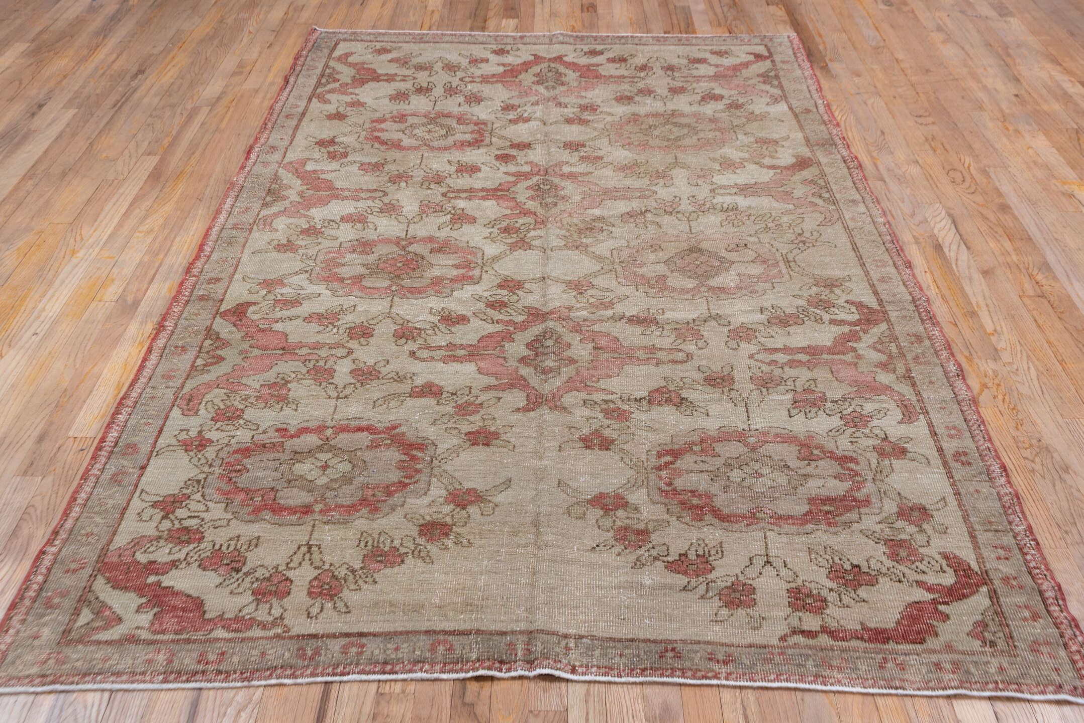 5' x 9' one-of-a-kind handmade vintage Oushak medium size rug. Color palette: brown, gray, off-white, pink, red