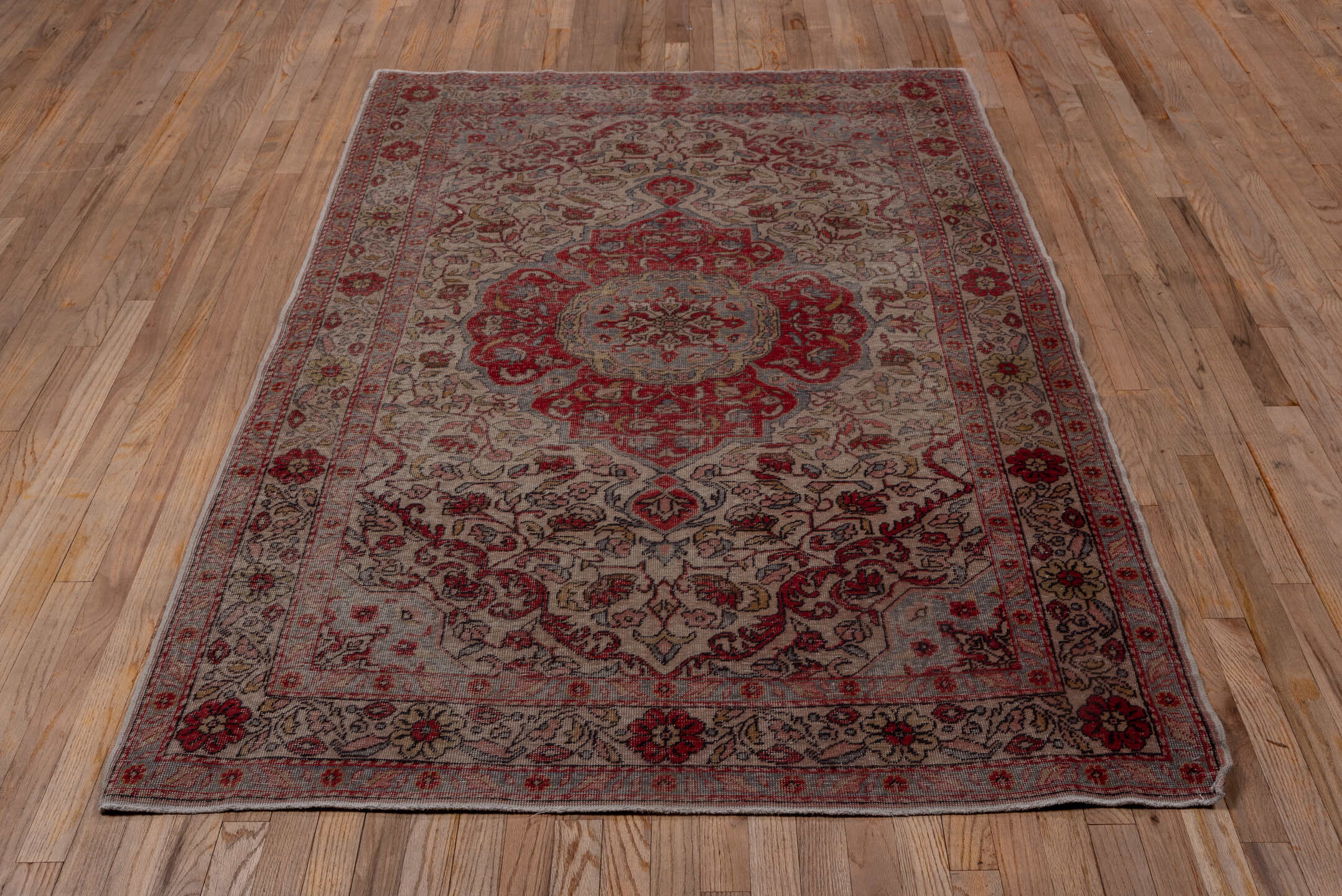 4' x 7' one-of-a-kind handmade vintage Sivas rug. Color palette: ivory, rose, muted red, pale blue, taupe, burgundy, pink