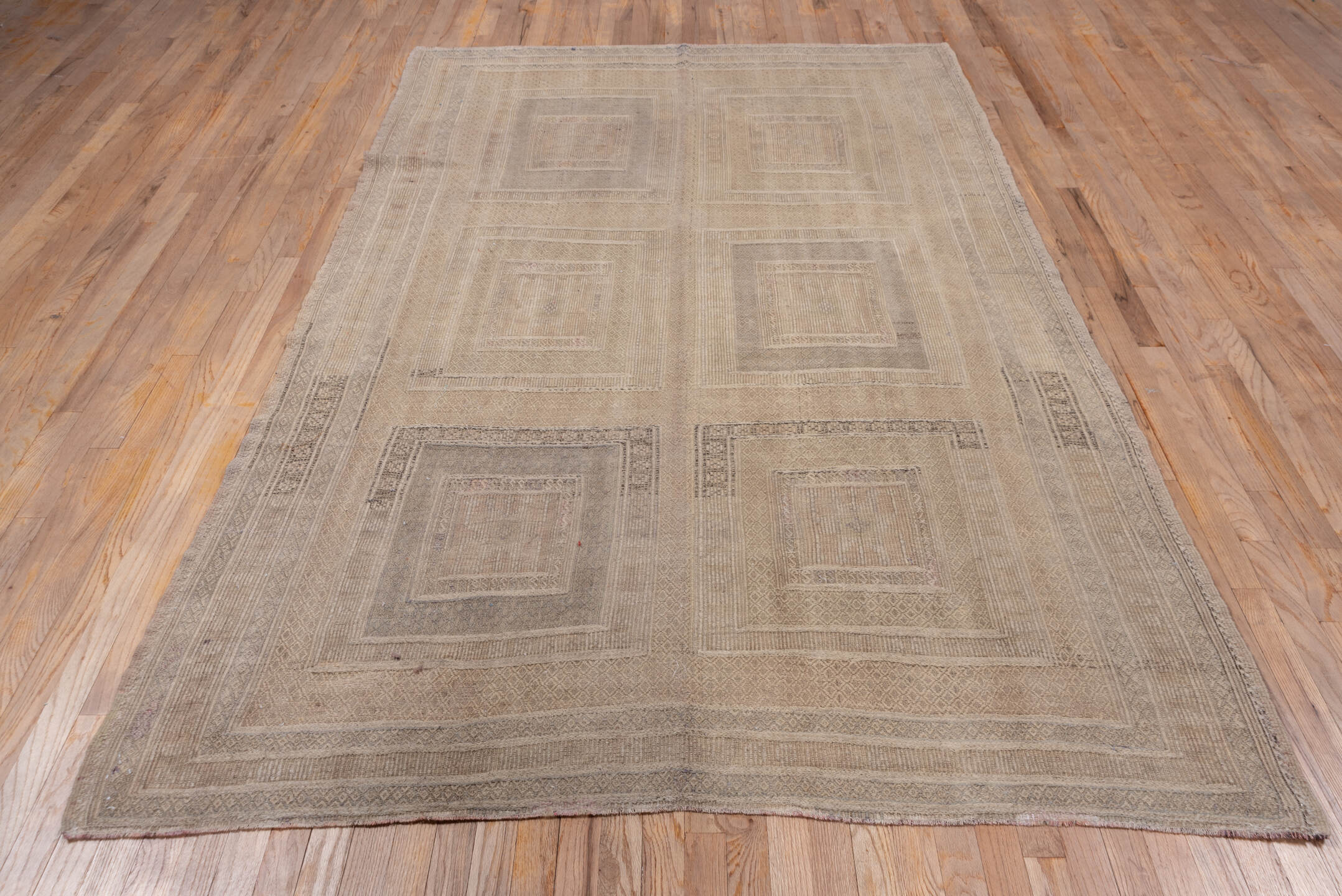 5' x 9' one-of-a-kind handmade vintage Jijim medium size rug. Color palette: gray, light gray, off-white, pink, snow, white