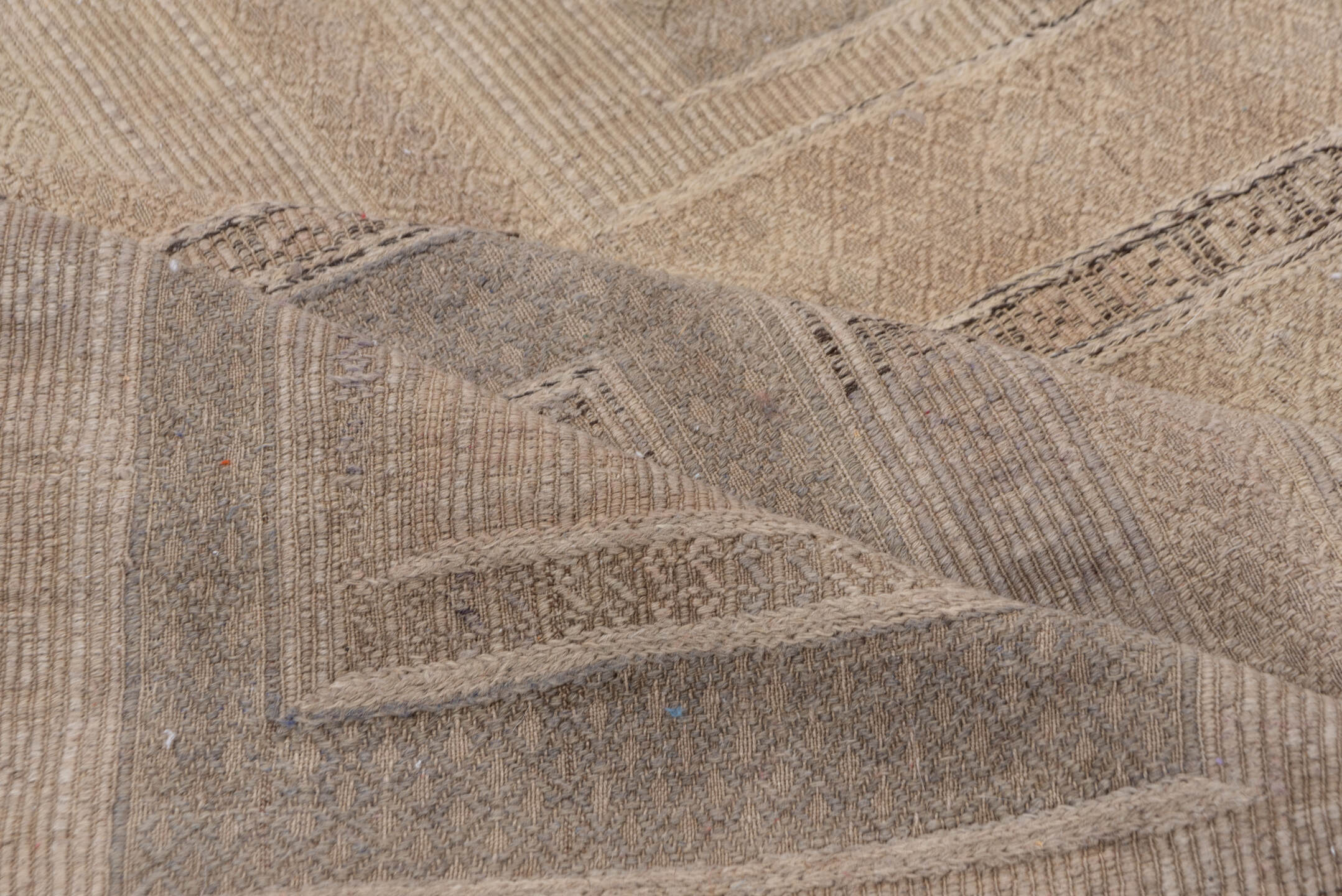 5' x 9' one-of-a-kind handmade vintage Jijim medium size rug. Color palette: gray, light gray, off-white, pink, snow, white