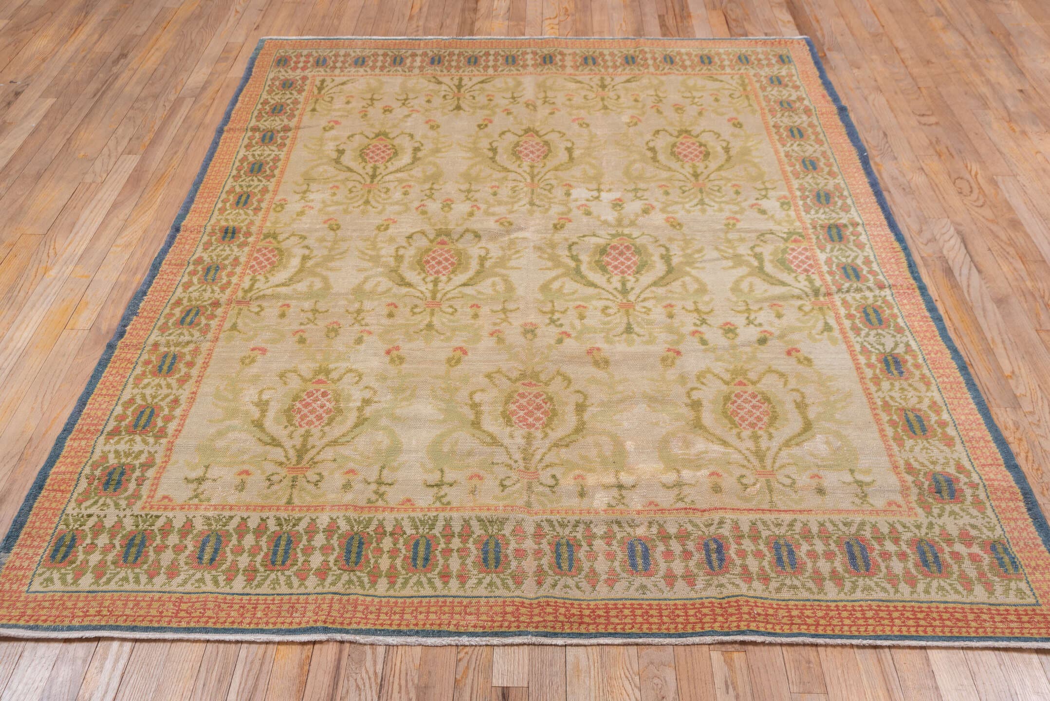 5' x 7' one-of-a-kind handmade antique Spanish rug. Color palette: ivory, olive, rose, gold, navy, sage, green, pink, red