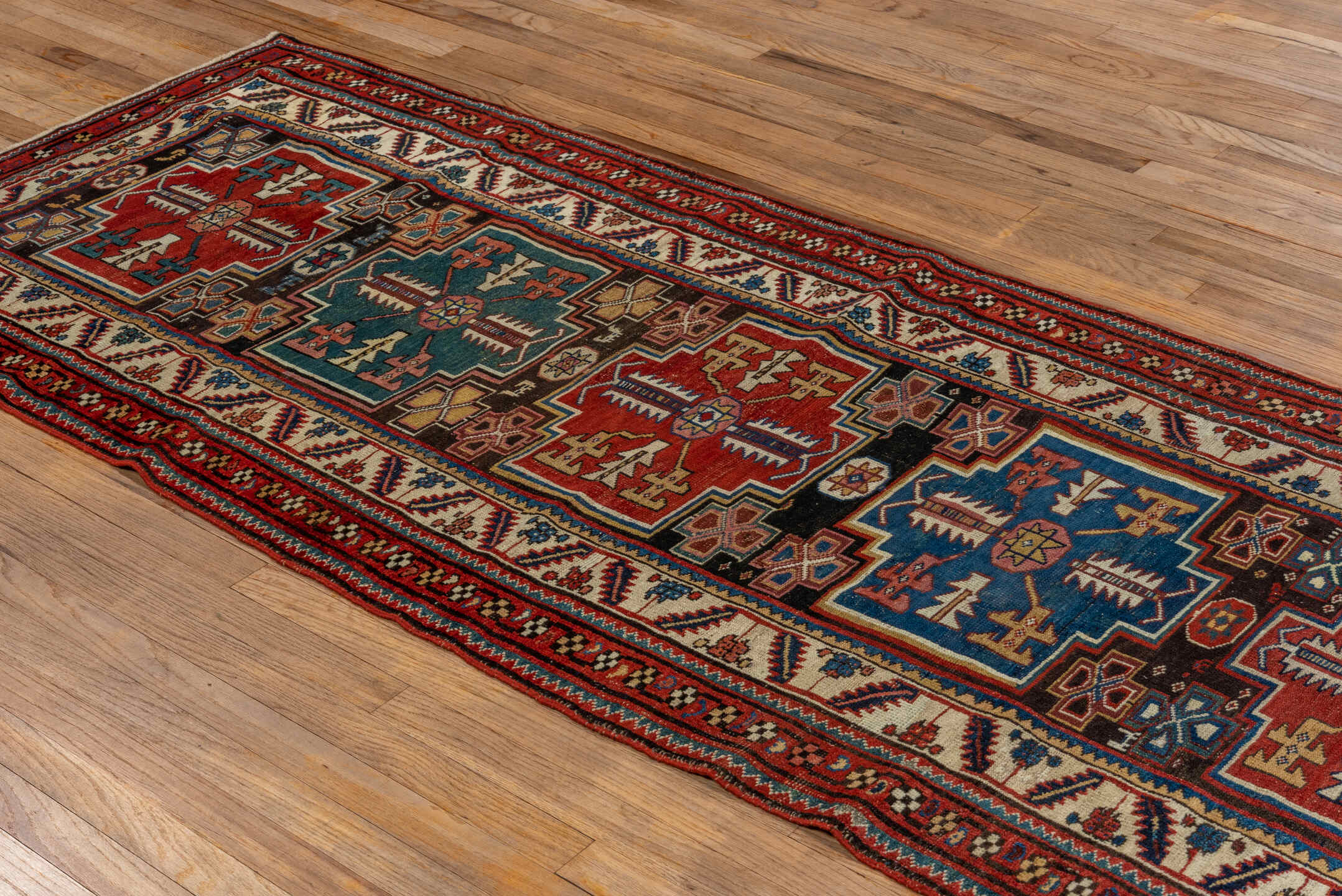 3' x 9' one-of-a-kind handmade vintage Malayer runner rug. Color palette: red, ivory, blue, charcoal, camel, rust, teal