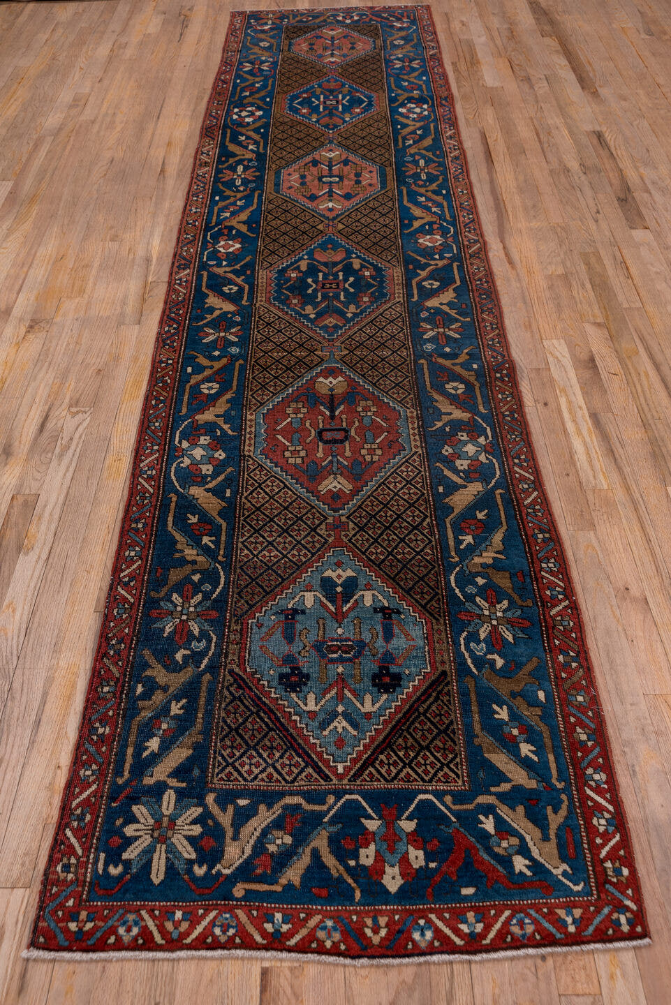 2' x 13' one-of-a-kind handmade antique Sarab runner rug. Color palette: navy, rust, camel, ivory, sky_blue, crimson