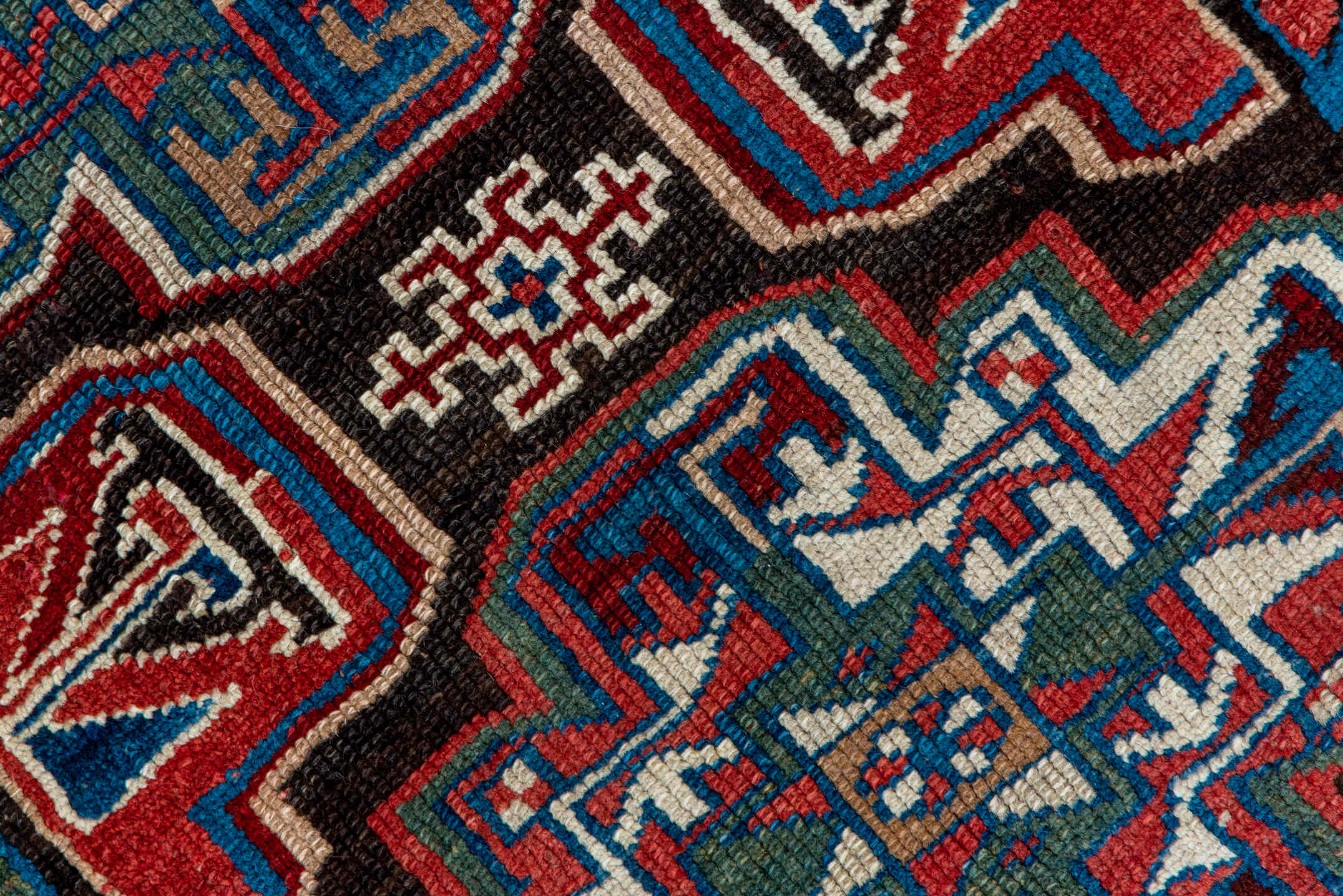 3' x 10' one-of-a-kind handmade vintage Kurd runner rug. Color palette: black, blue, brown, gray, pink, red