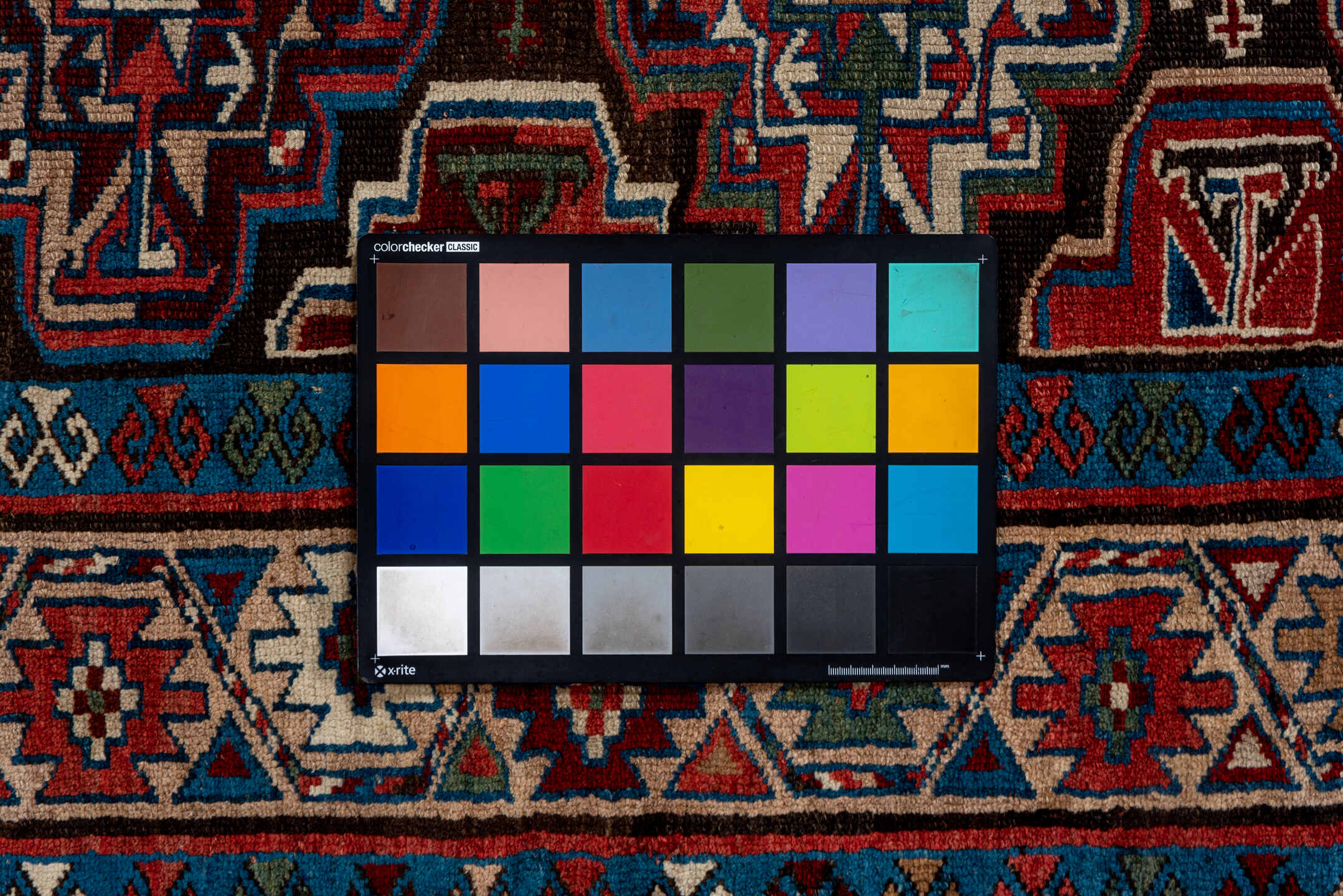 3' x 10' one-of-a-kind handmade vintage Kurd runner rug. Color palette: black, blue, brown, gray, pink, red