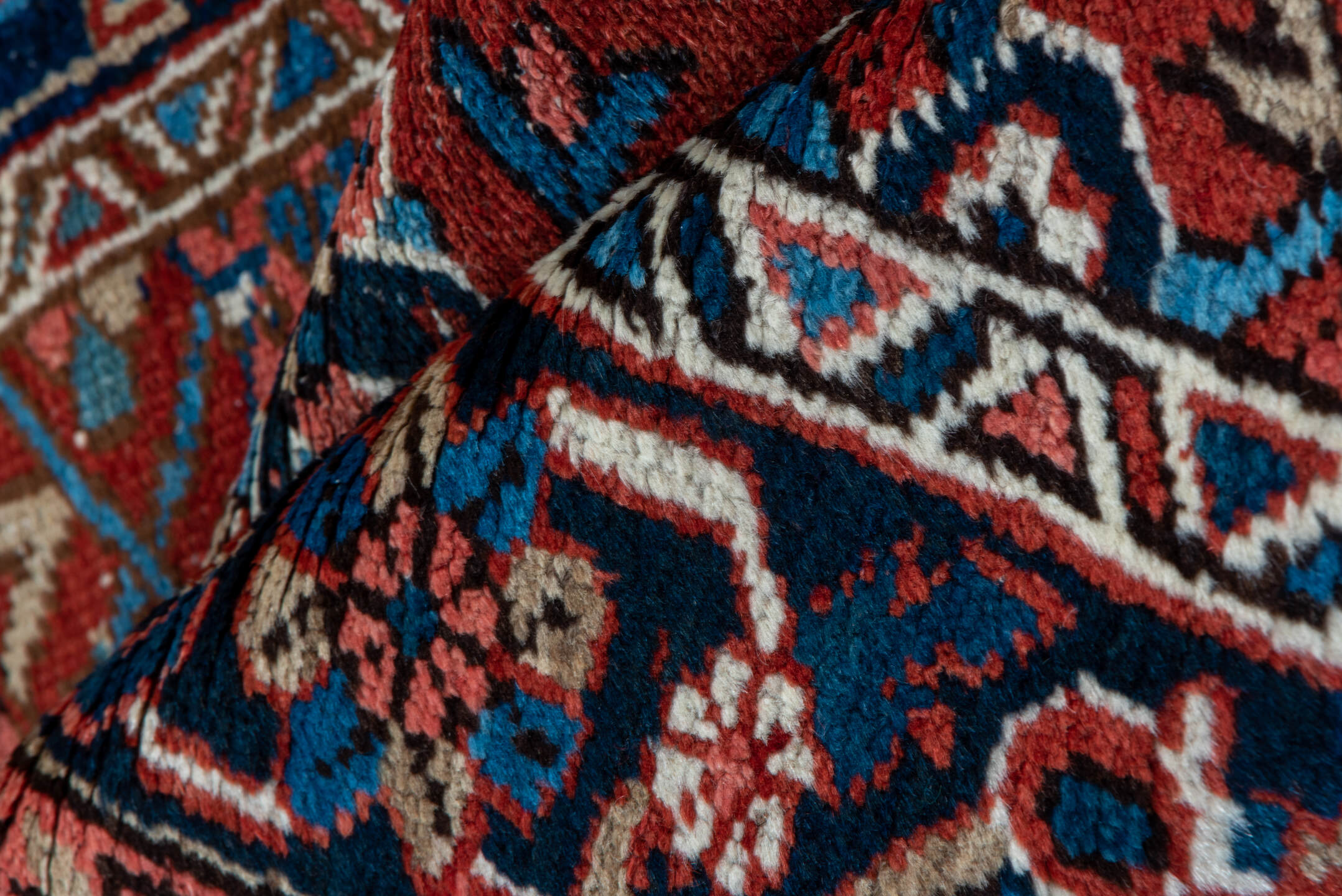 3' x 12' one-of-a-kind handmade vintage Heriz runner rug. Color palette: blue, brown, gray, orange, pink, red, wine