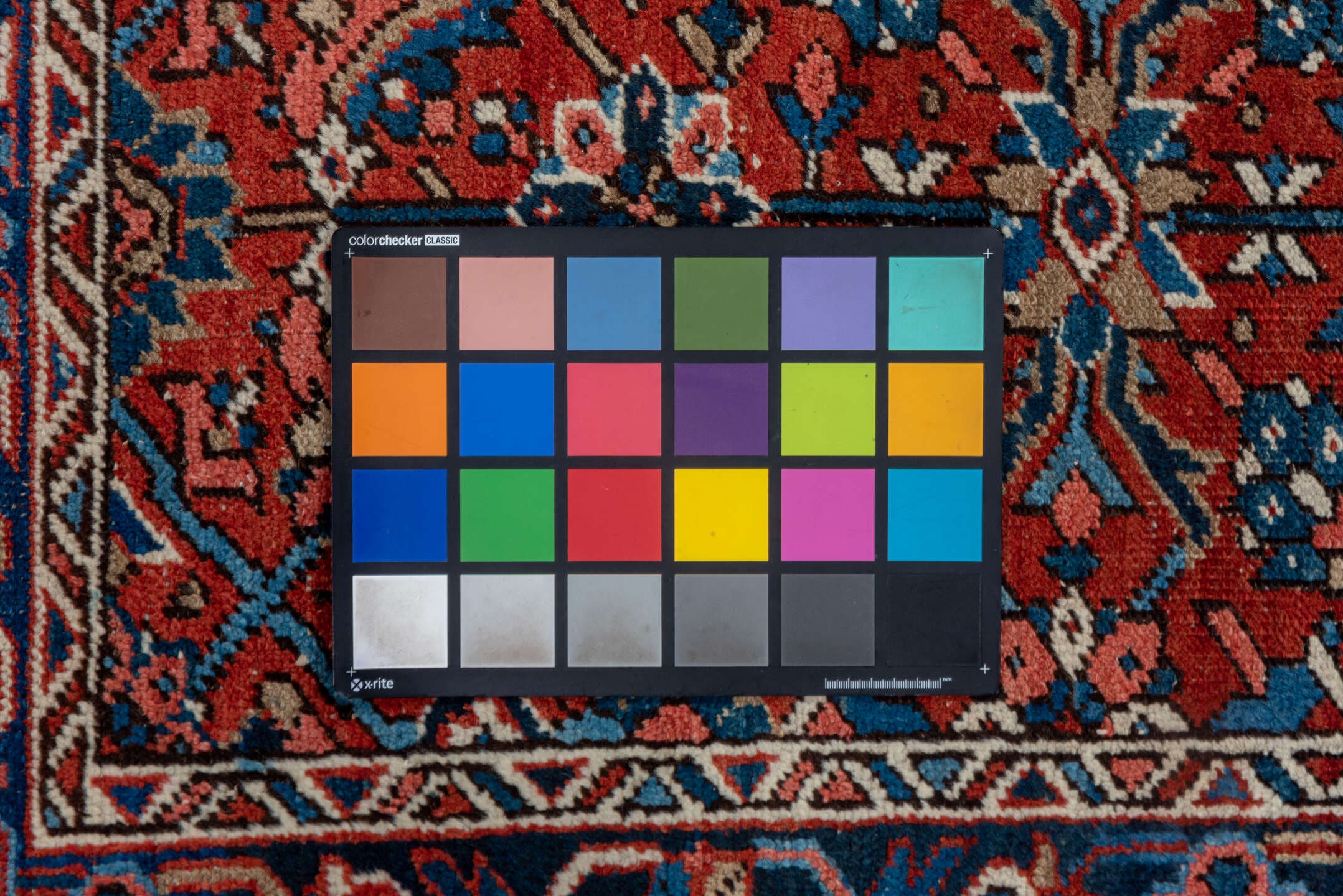3' x 12' one-of-a-kind handmade vintage Heriz runner rug. Color palette: rust, navy, ivory, sky blue, rose, camel