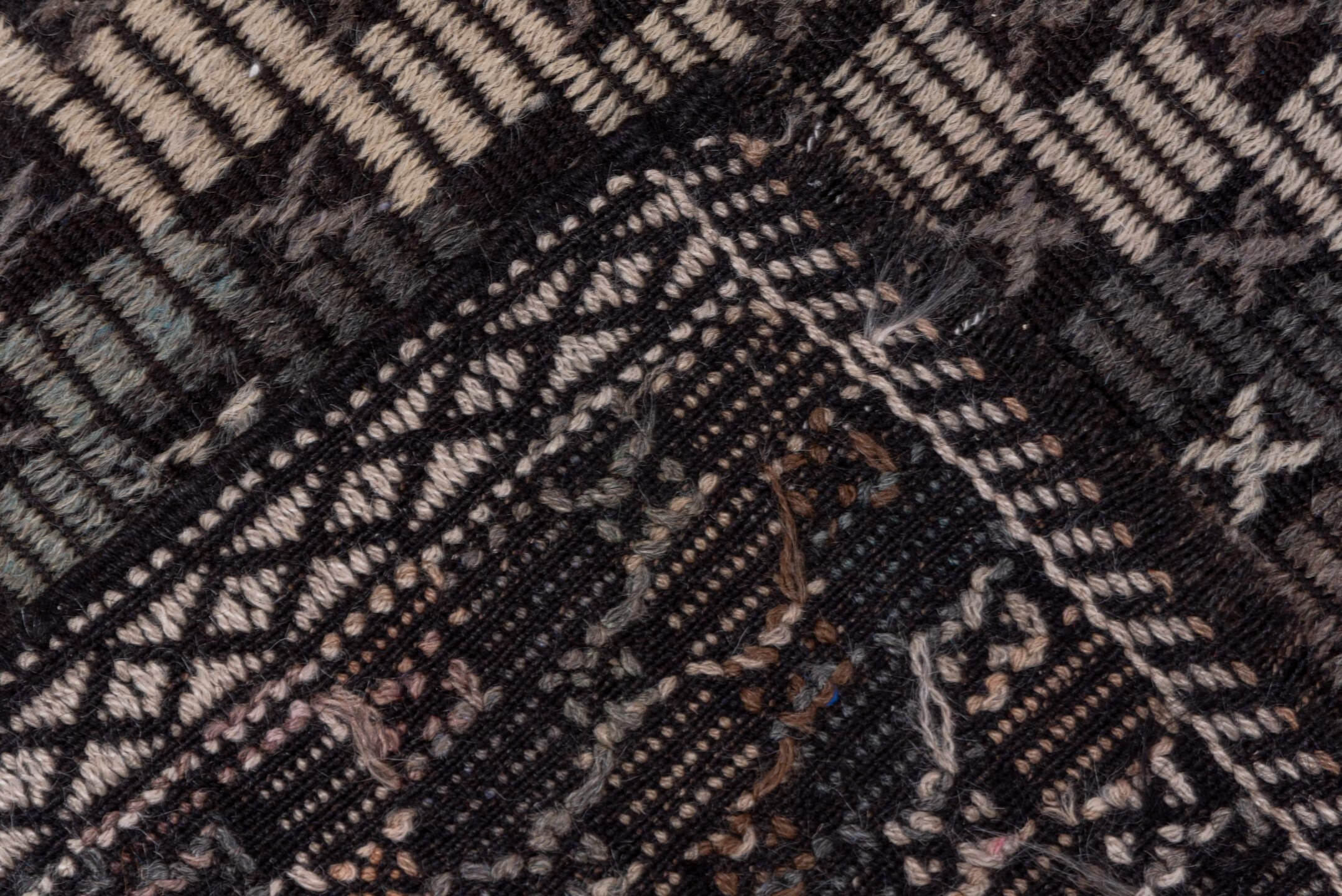 7' x 9' one-of-a-kind handmade vintage Jijim rug. Color palette: charcoal, ivory, slate, taupe, brown, gray, black, beige