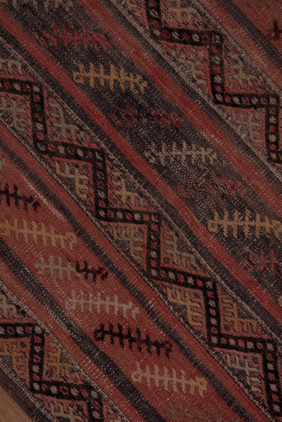 2' x 15' one-of-a-kind handmade vintage Jijim runner rug. Color palette: brown, gray, off-white, pink, red, redwood, snow