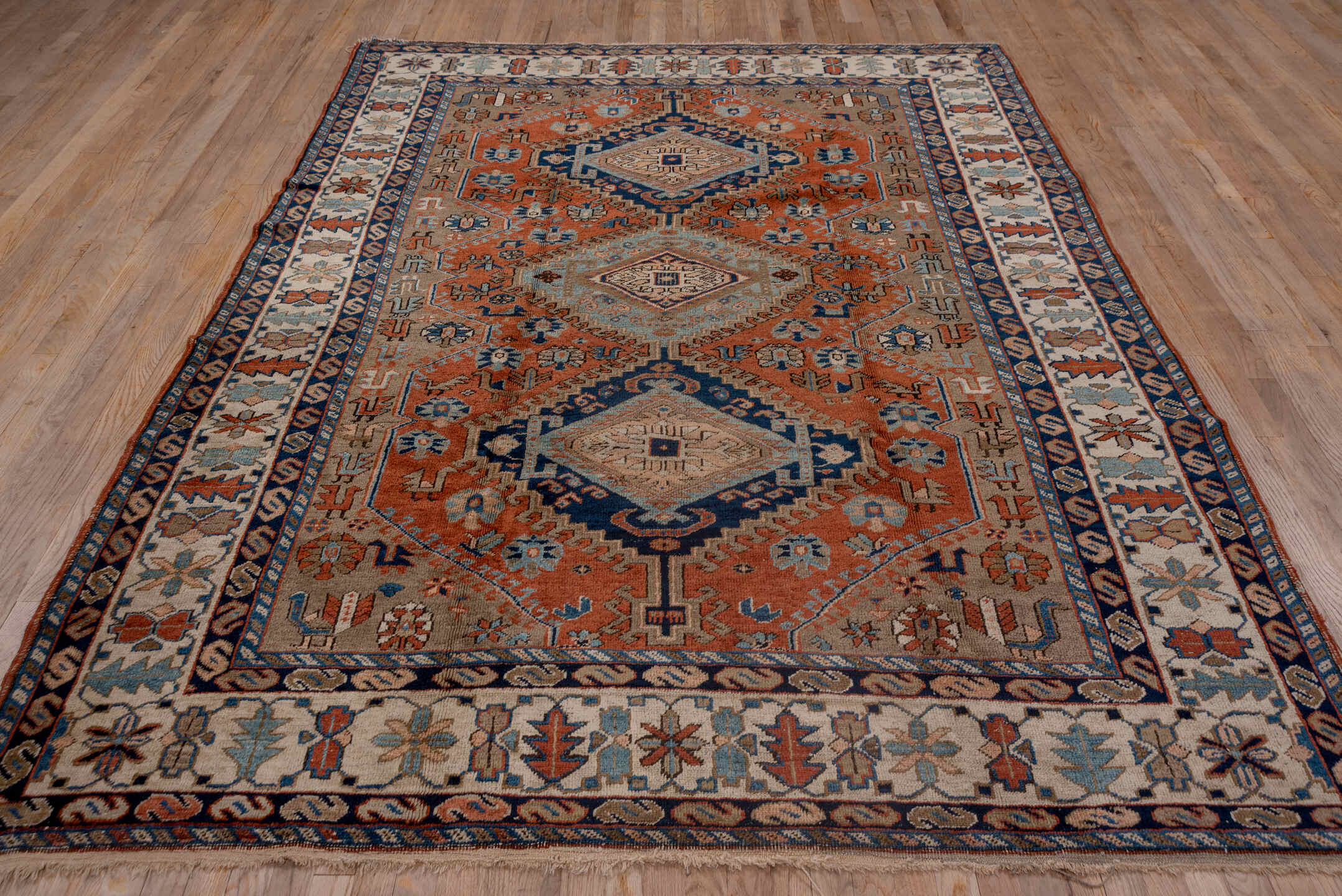 7' x 9' one-of-a-kind handmade vintage Heriz rug. Color palette: blue, brown, dim gray, gray, light gray, off-white, pink