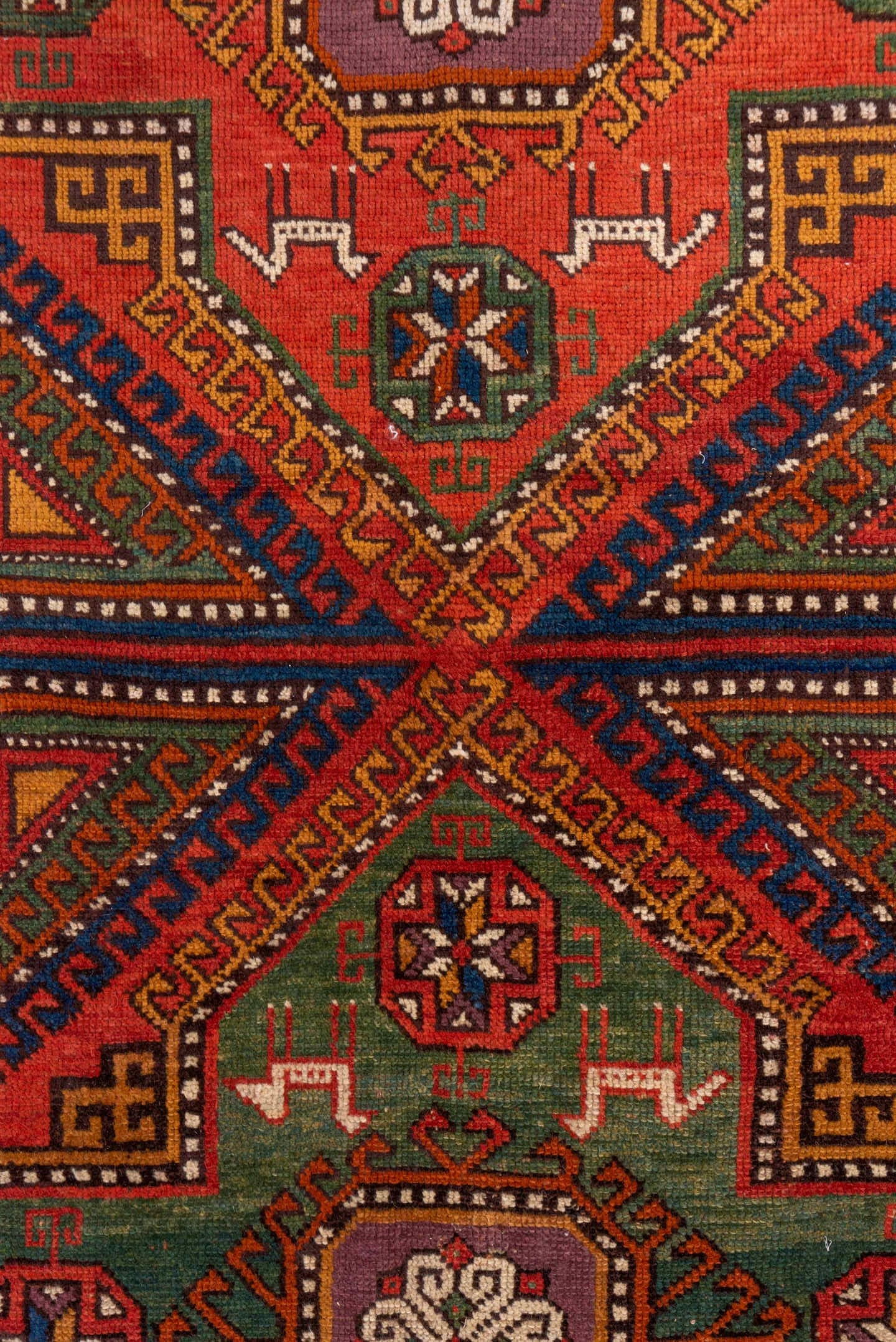 4' x 8' one-of-a-kind handmade antique Konya rug. Color palette: rust, terra cotta, sage, indigo, ivory, camel, burgundy