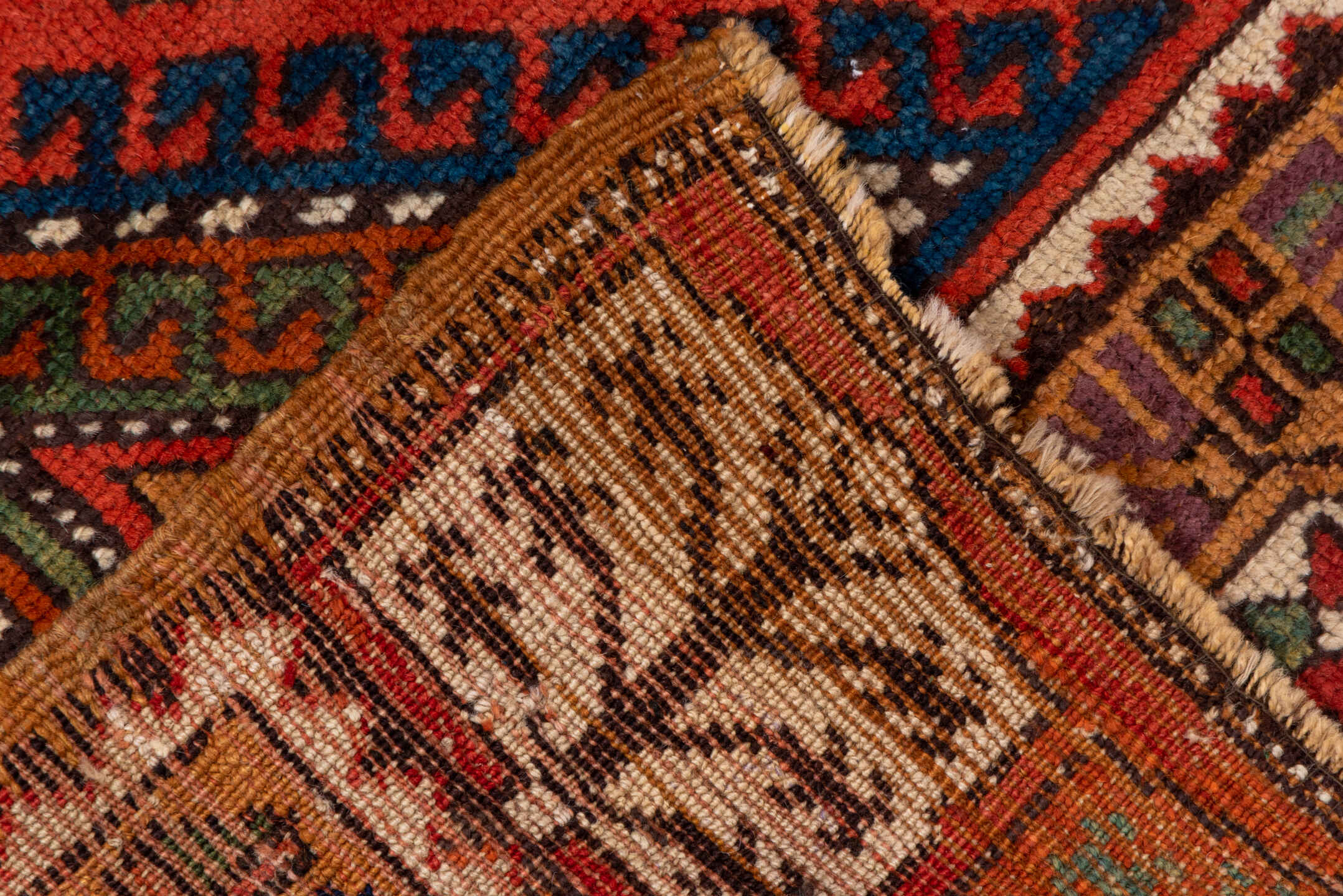 4' x 8' one-of-a-kind handmade antique Konya rug. Color palette: rust, terra cotta, sage, indigo, ivory, camel, burgundy