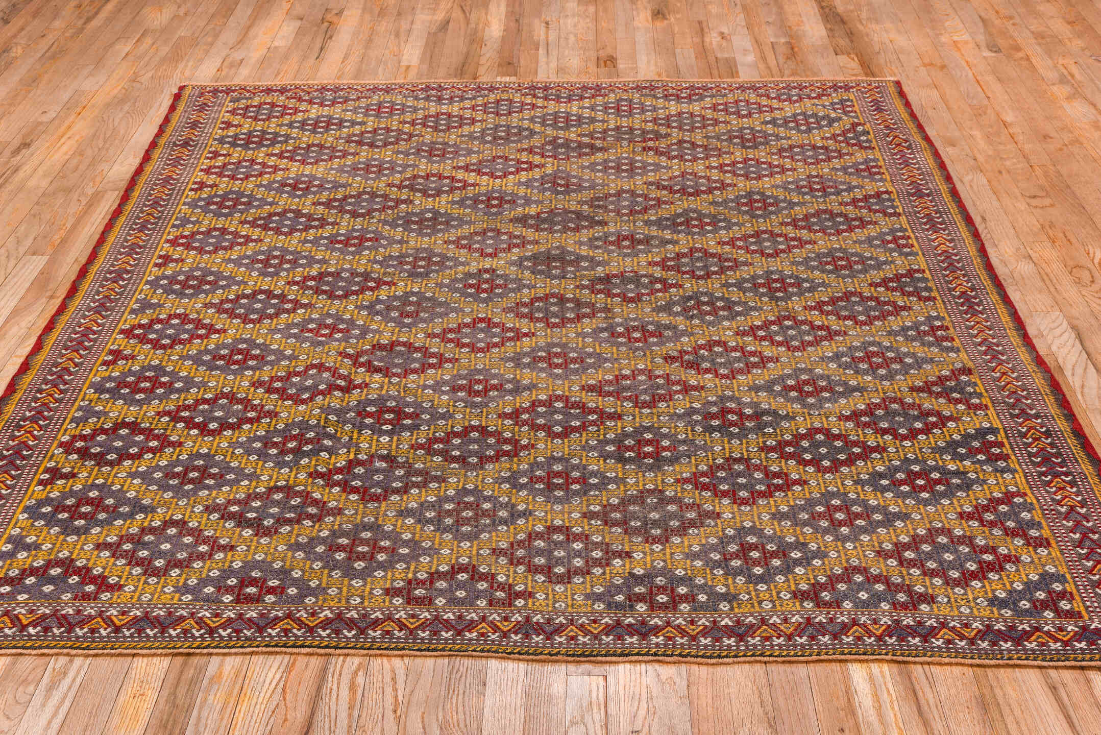 6' x 7' one-of-a-kind handmade vintage Jijim rug. Color palette: brown, gray, light gray, off-white, orange, pink, red, snow