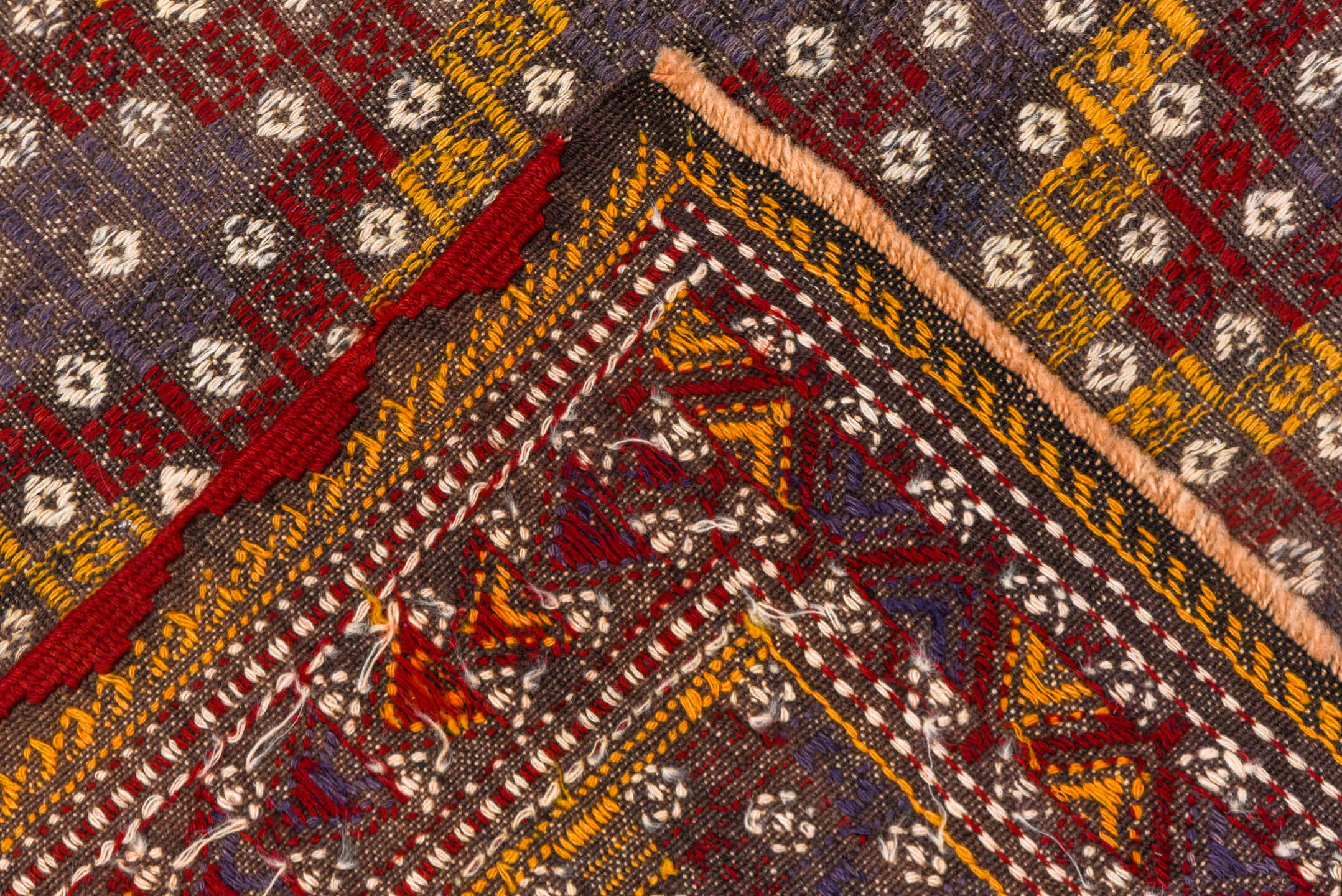 6' x 7' one-of-a-kind handmade vintage Jijim rug. Color palette: brown, gray, light gray, off-white, orange, pink, red, snow