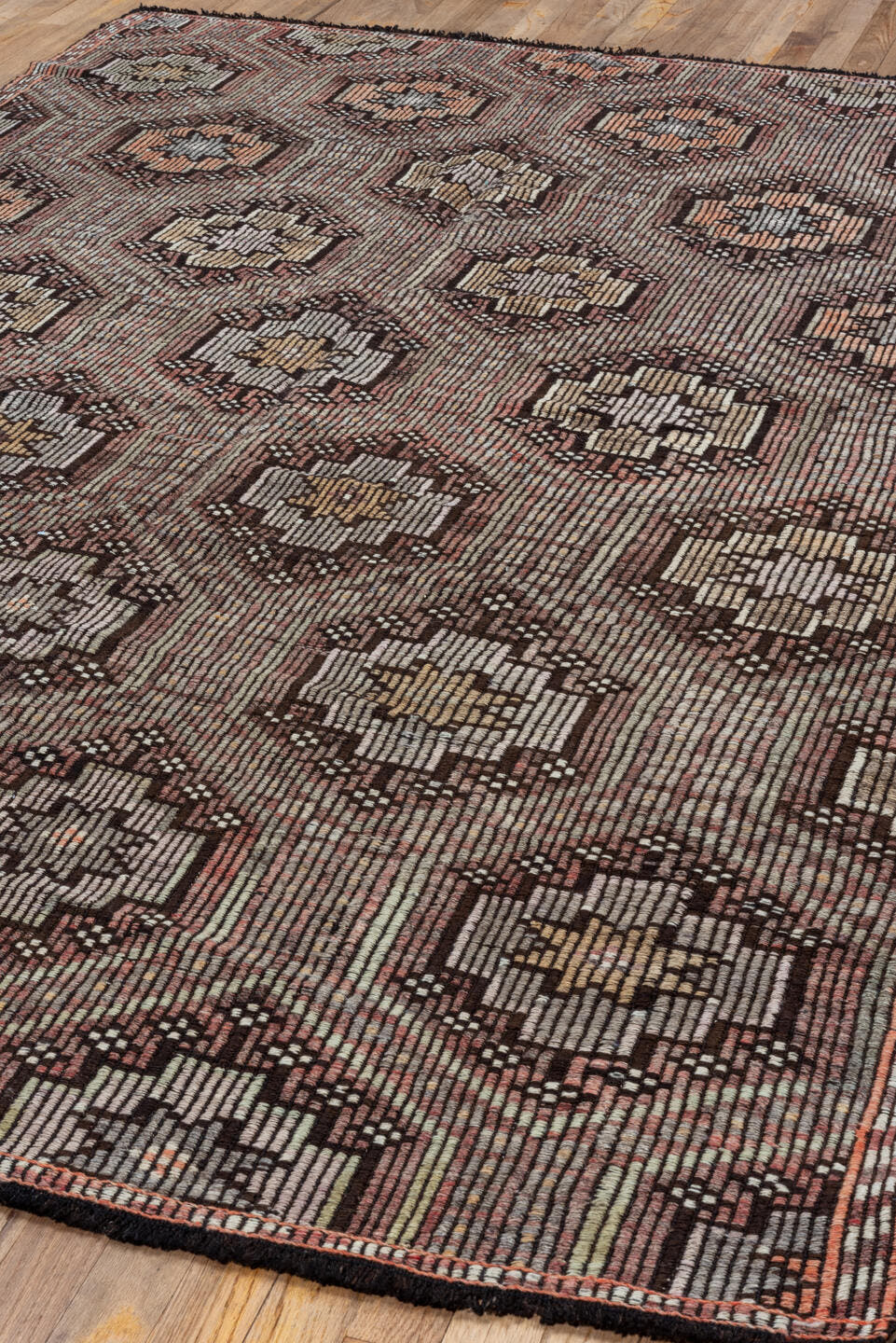 5' x 8' one-of-a-kind handmade vintage Jijim medium size rug. Color palette: rose, ivory, brown, taupe, charcoal, pink, red