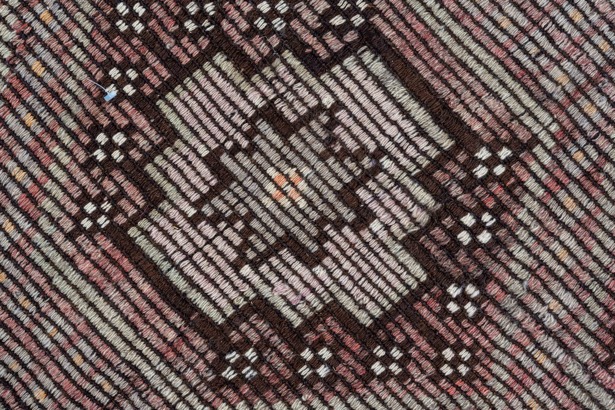 5' x 8' one-of-a-kind handmade vintage Jijim medium size rug. Color palette: black, brown, gray, light gray, off-white, pink