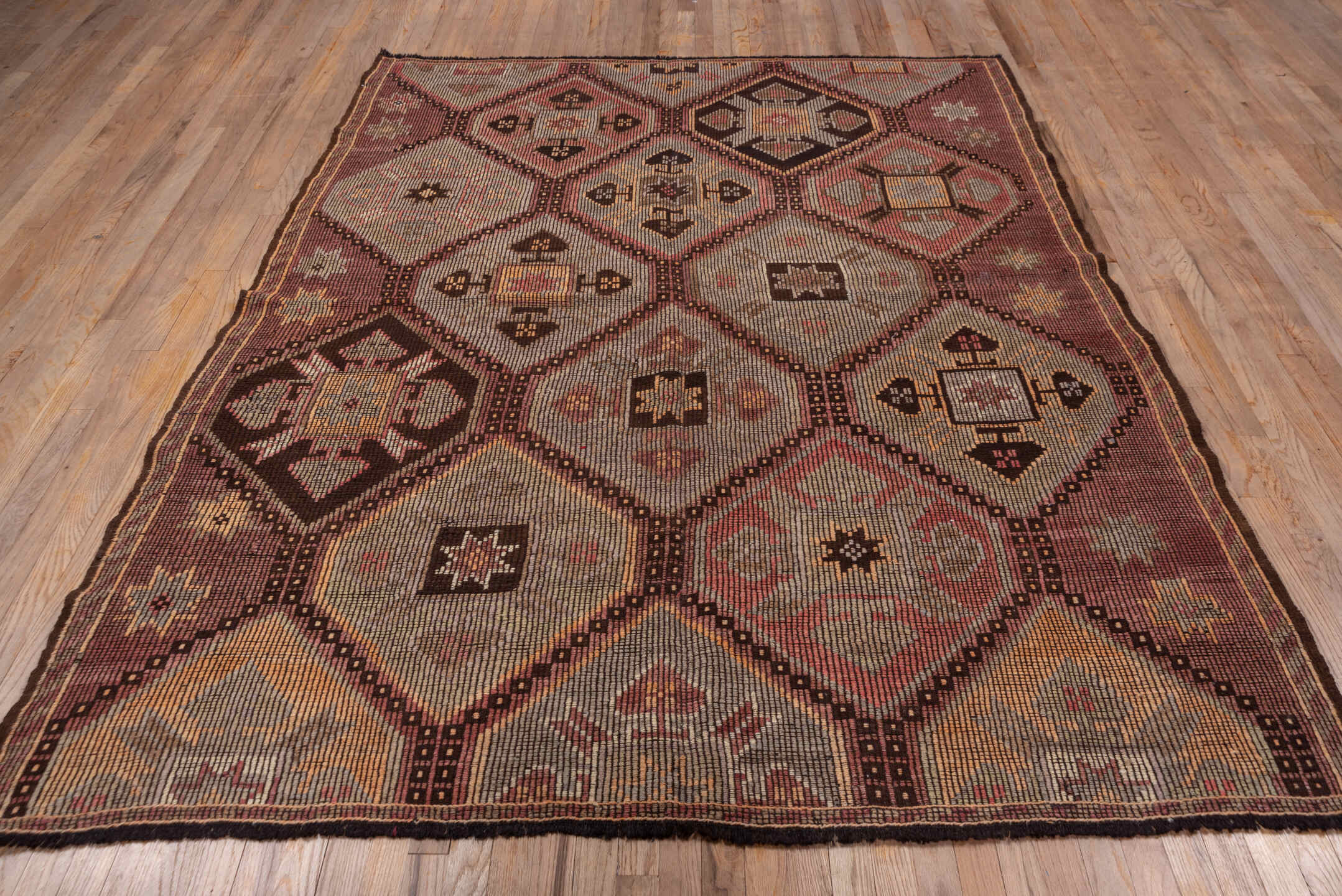 6' x 8' one-of-a-kind handmade vintage Jijim medium size rug. Color palette: brown, gray, light gray, pink, red, redwood