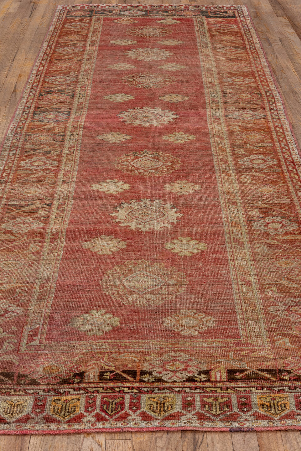 4' x 12' one-of-a-kind handmade vintage Oushak runner rug. Color palette: coral, ivory, rust, camel, brown, charcoal