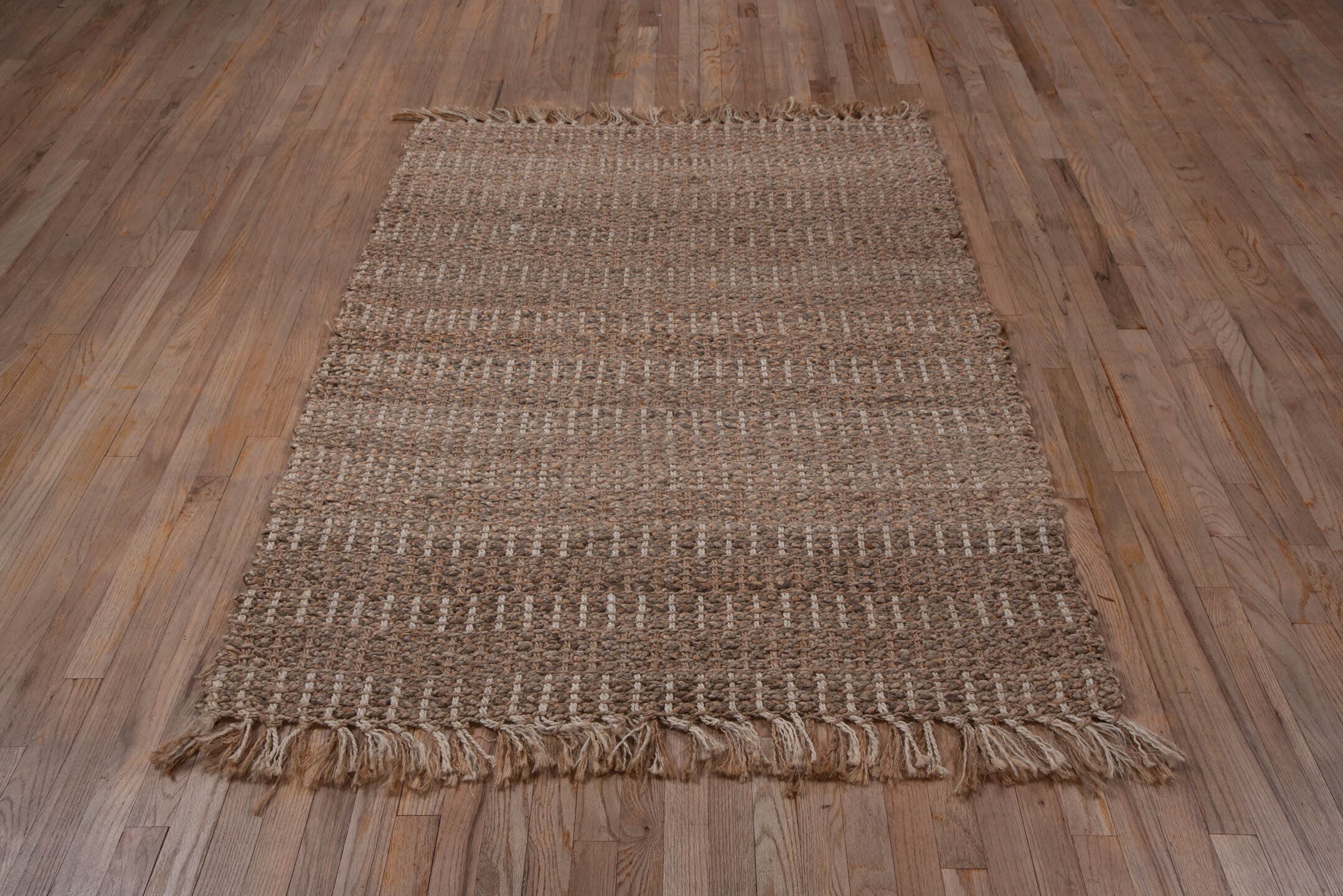 4' x 6' one-of-a-kind handmade vintage Sisal small size rug. Color palette: taupe, brown, camel, beige, gray