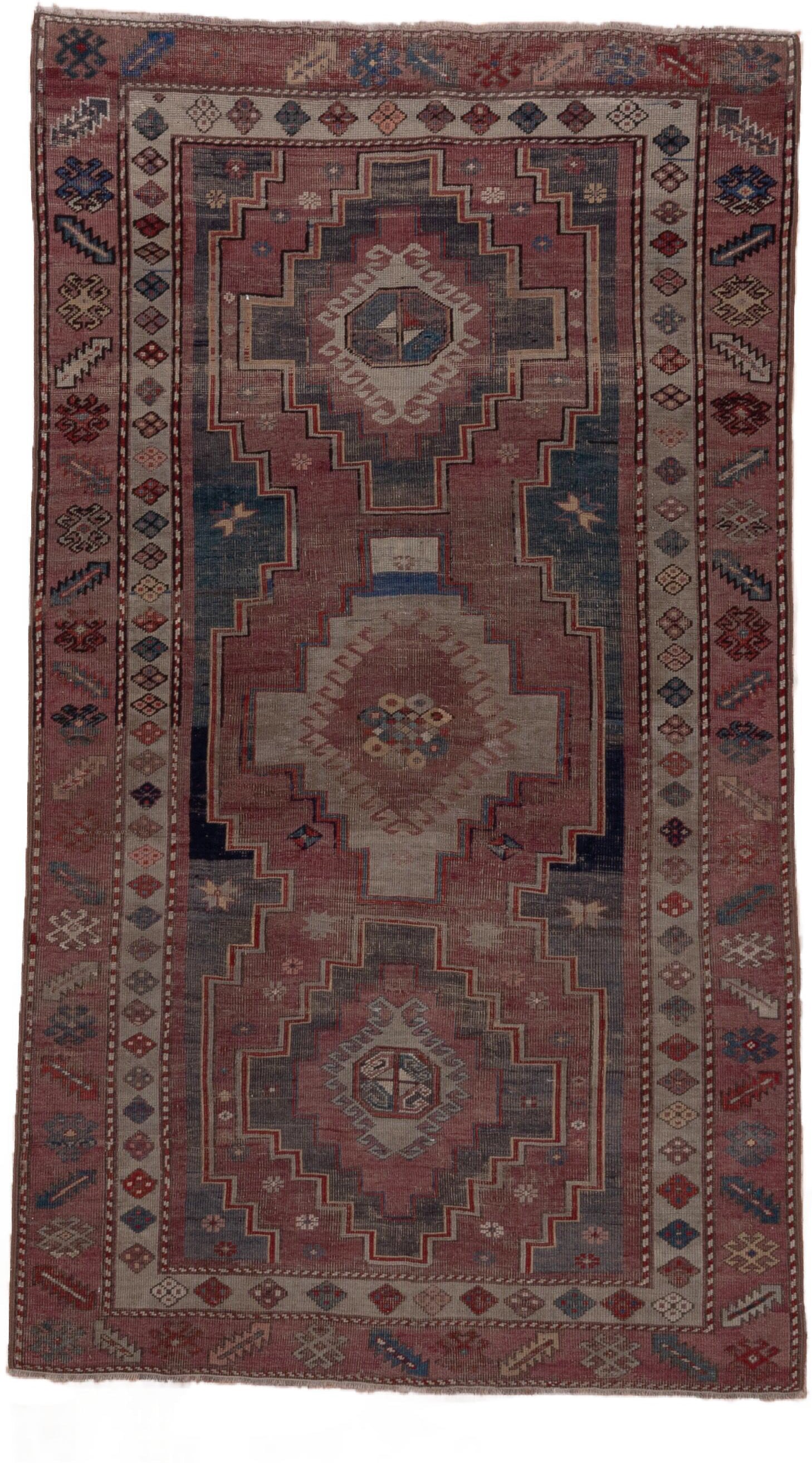 4' x 7' one-of-a-kind handmade antique Trans Caucasian rug. Color palette: rose, dusty rose, ivory, indigo, rust, taupe
