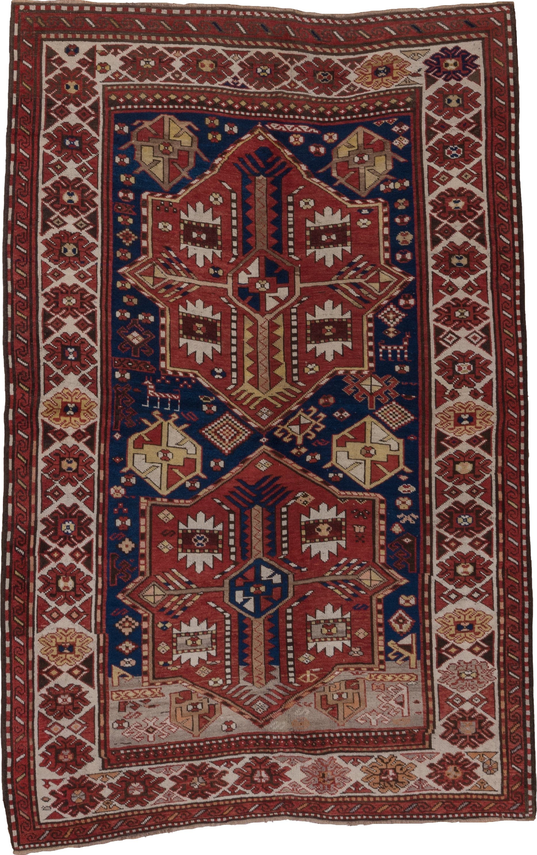 5' x 7' one-of-a-kind handmade antique Trans Caucasian rug. Color palette: rust, ivory, navy, burgundy, camel, crimson, gold