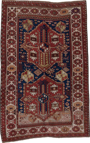 5' x 7' one-of-a-kind handmade antique Trans Caucasian rug. Color palette: rust, ivory, navy, burgundy, camel, crimson, gold