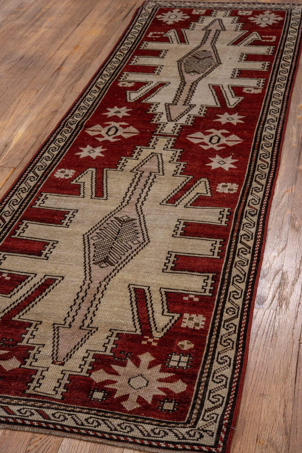 2' x 7' one-of-a-kind handmade antique Trans Caucasian runner rug. Color palette: rust, ivory, brown, charcoal, terracotta