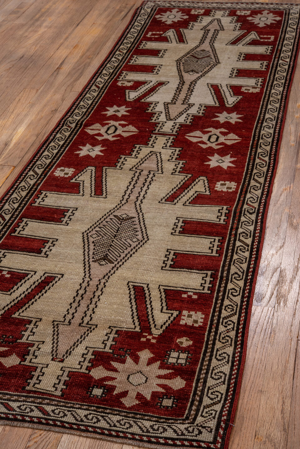 2' x 7' one-of-a-kind handmade vintage Trans Caucasian runner rug. Color palette: brown, off-white, pink, red, snow, white