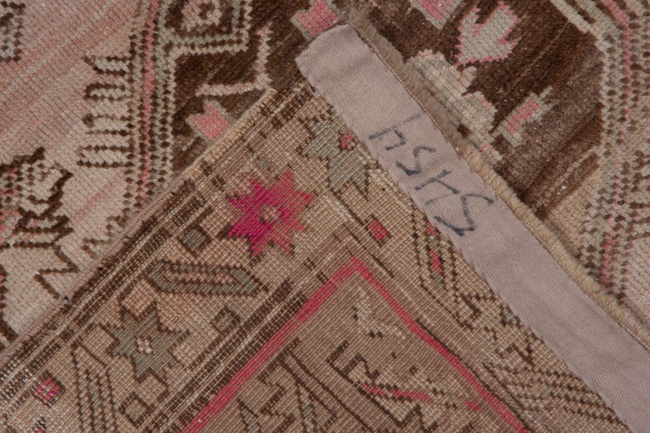 4' x 9' one-of-a-kind handmade antique Trans Caucasian runner rug. Color palette: ivory, taupe, brown, dusty_rose, camel