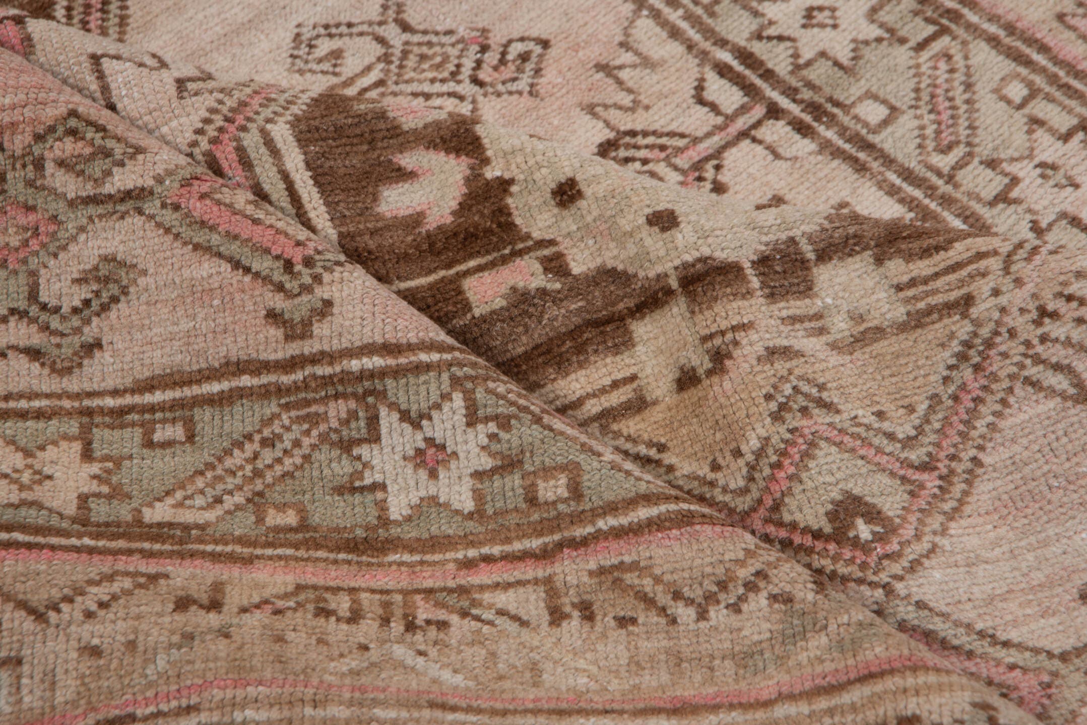 4' x 9' one-of-a-kind handmade antique Trans Caucasian runner rug. Color palette: ivory, taupe, brown, dusty_rose, camel