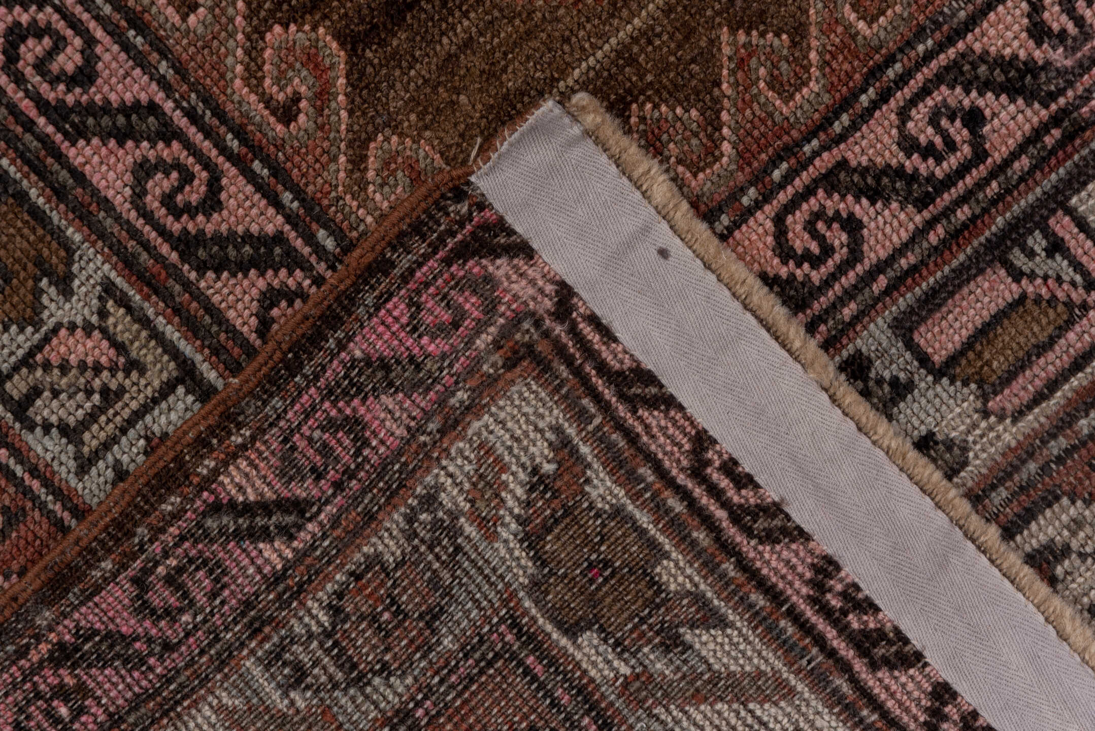 4' x 12' one-of-a-kind handmade vintage Trans Caucasian runner rug. Color palette: brown, gray, pink, redwood