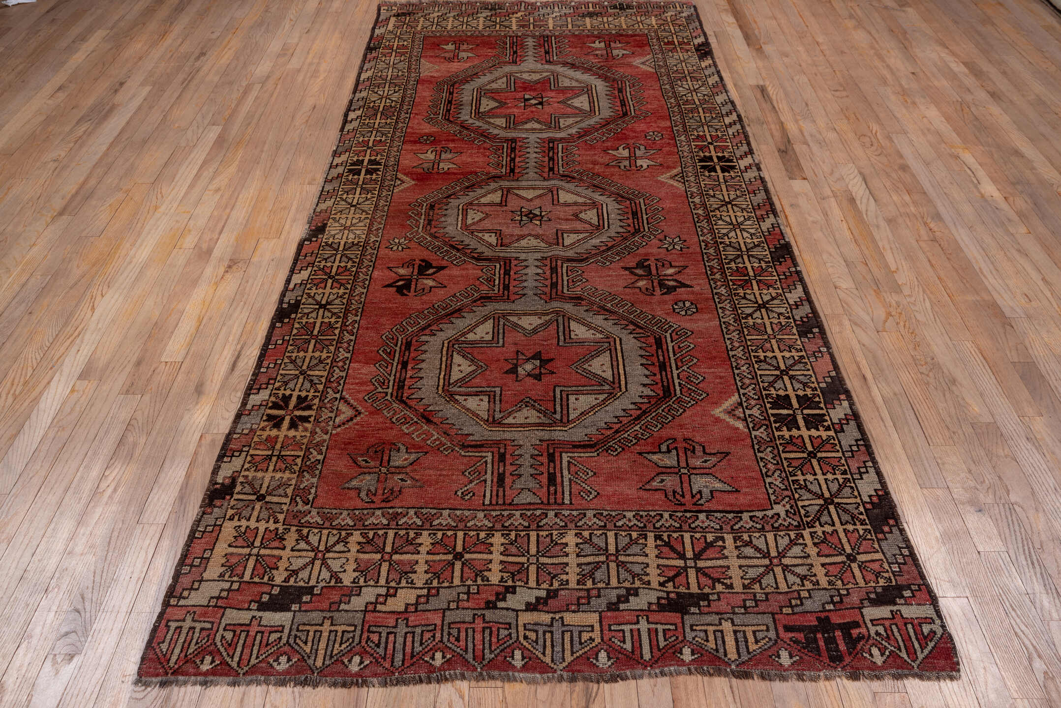 4' x 10' one-of-a-kind handmade vintage Oushak runner rug. Color palette: brown, gray, pink, red, redwood