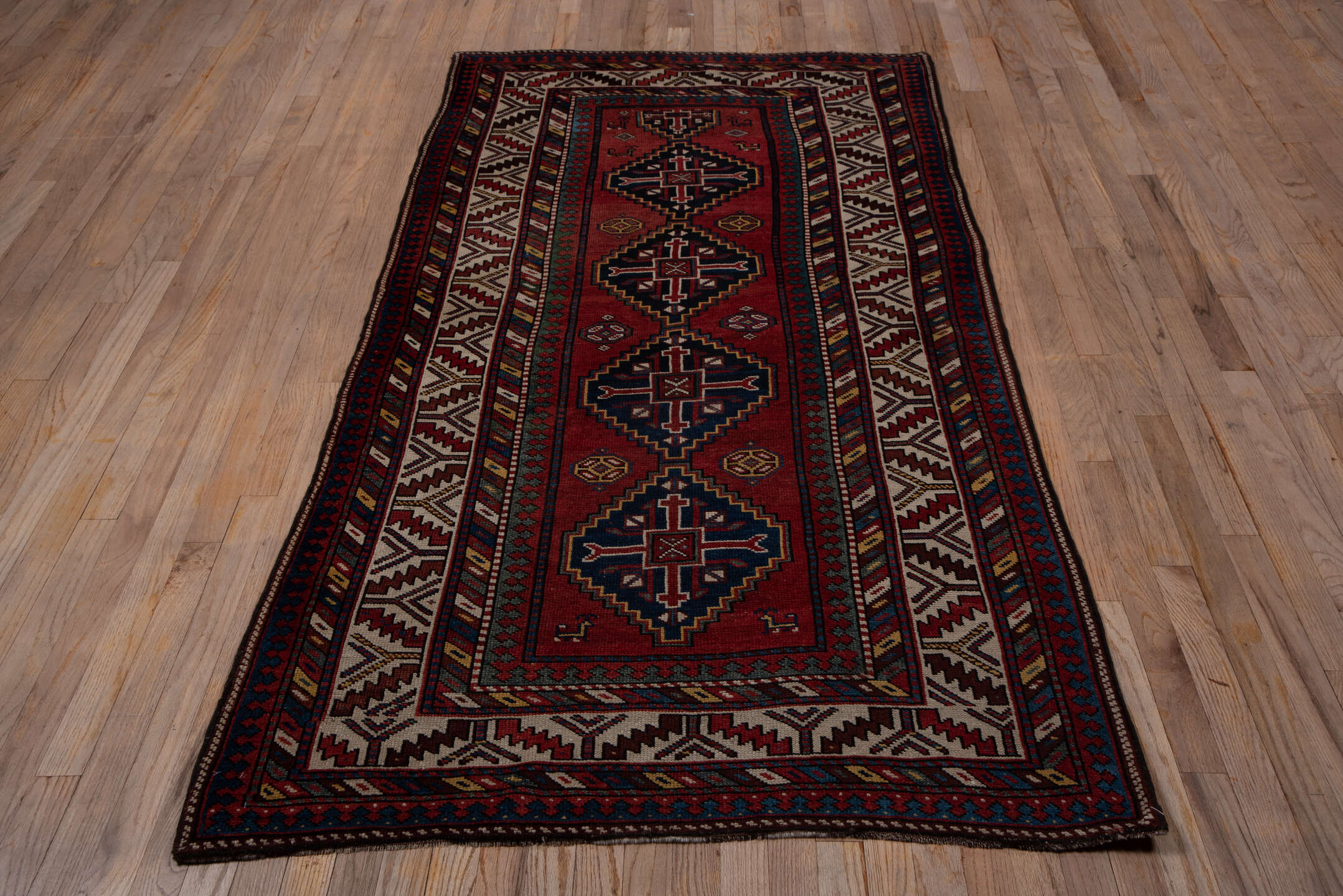 9' x 11' one-of-a-kind handmade vintage Afghan large size rug. Color palette: rust, navy, ivory, crimson, camel, charcoal