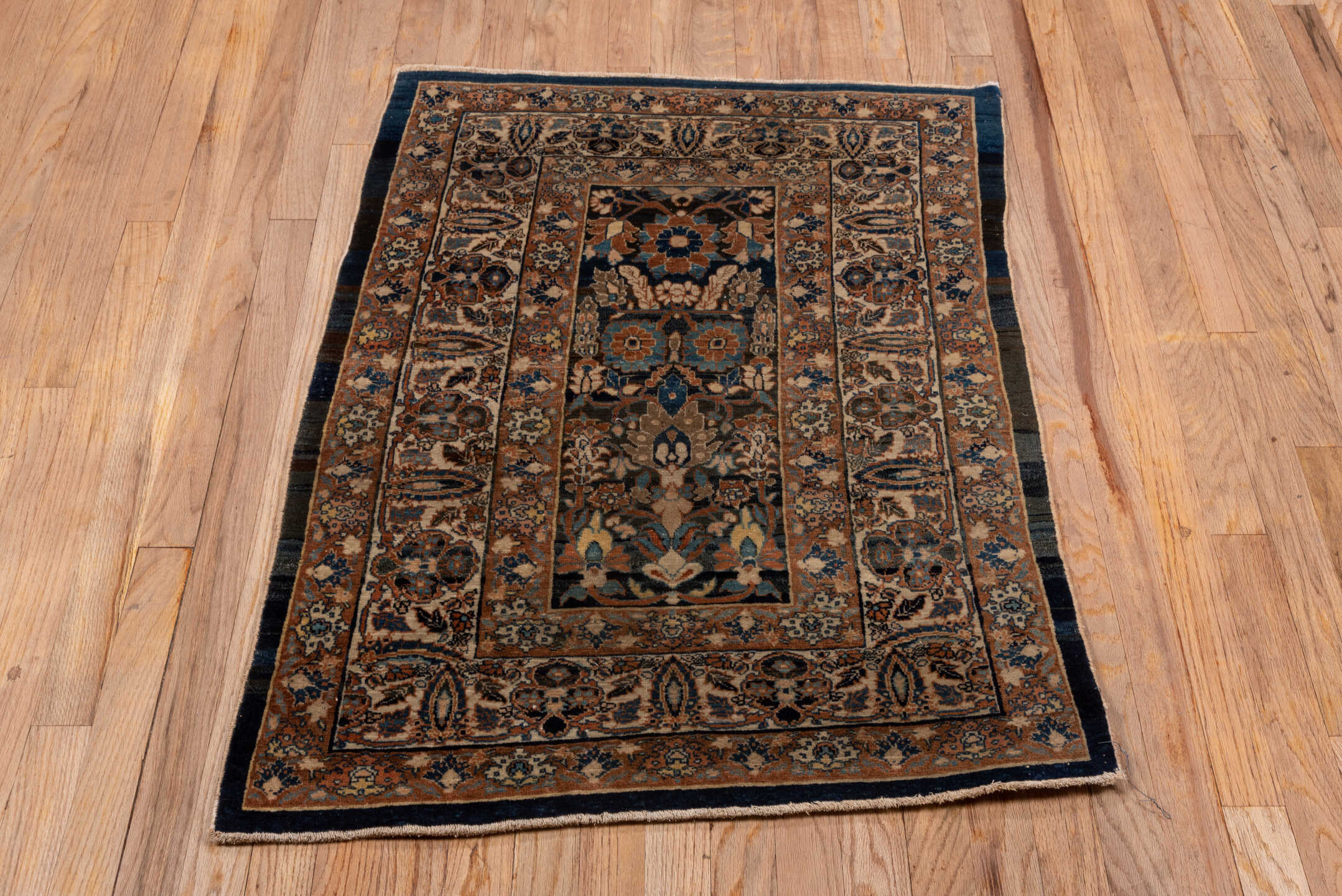 2' x 3' one-of-a-kind handmade vintage Tabriz small size rug. Color palette: camel, ivory, navy, brown, rust, sky_blue