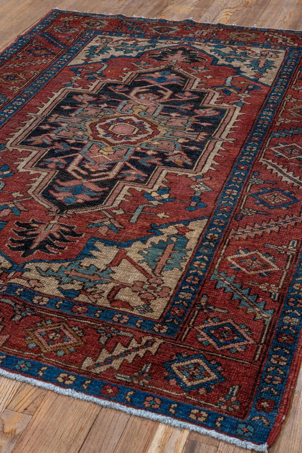 4' x 6' one-of-a-kind handmade antique Serapi small size rug. Color palette: rust, navy, ivory, teal, camel, rose, brown
