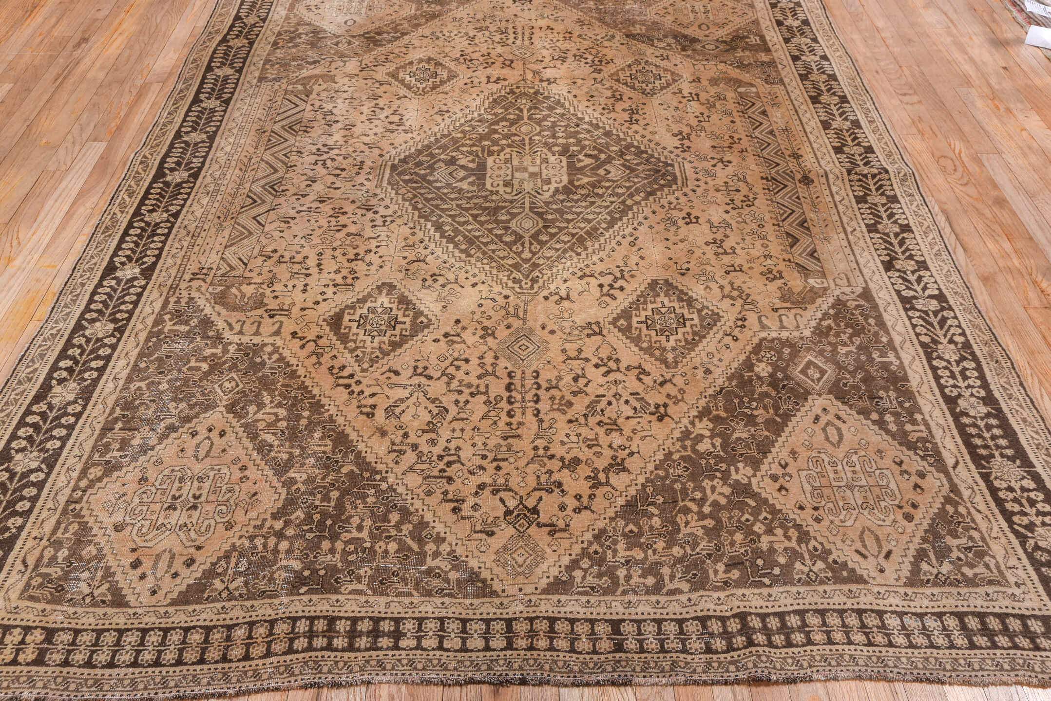6' x 9' one-of-a-kind handmade antique Shiraz medium size rug. Color palette: ivory, camel, brown, taupe, charcoal, beige