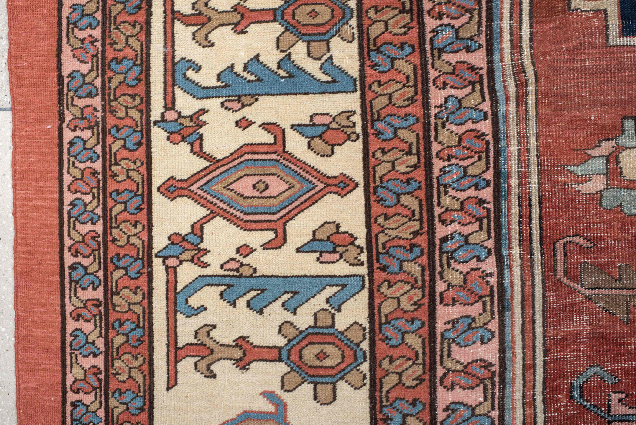 11' x 16' one-of-a-kind handmade vintage Serapi oversize rug. Color palette: terra cotta, ivory, sky blue, navy, rose